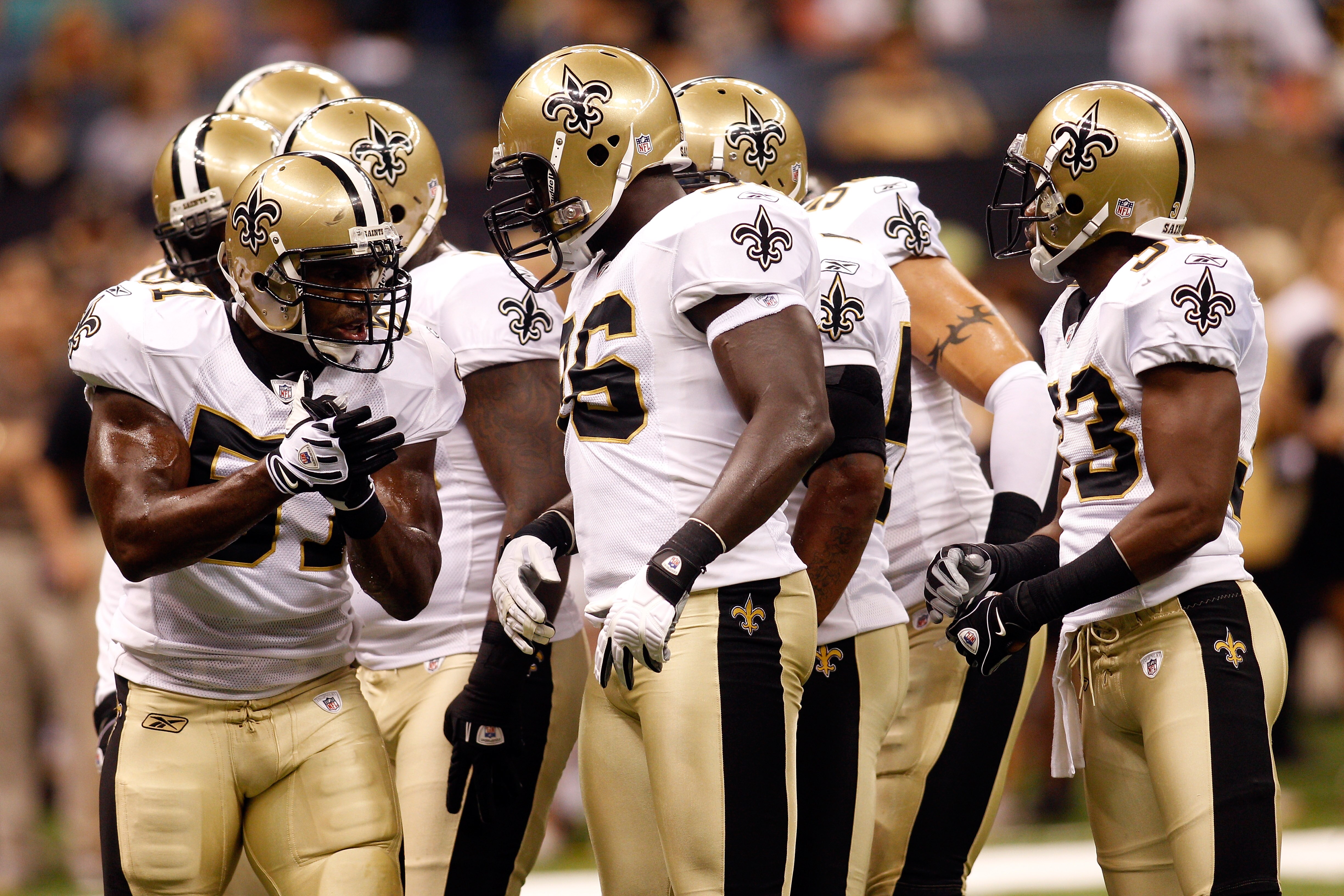 NEW ORLEANS - AUGUST 21:  Jonathan Vilma #51 of the New Orleans Saints talks with the defence against the Houston Texans at the Louisiana Superdome on August 21, 2010 in New Orleans, Louisiana.  (Photo by Chris Graythen/Getty Images)