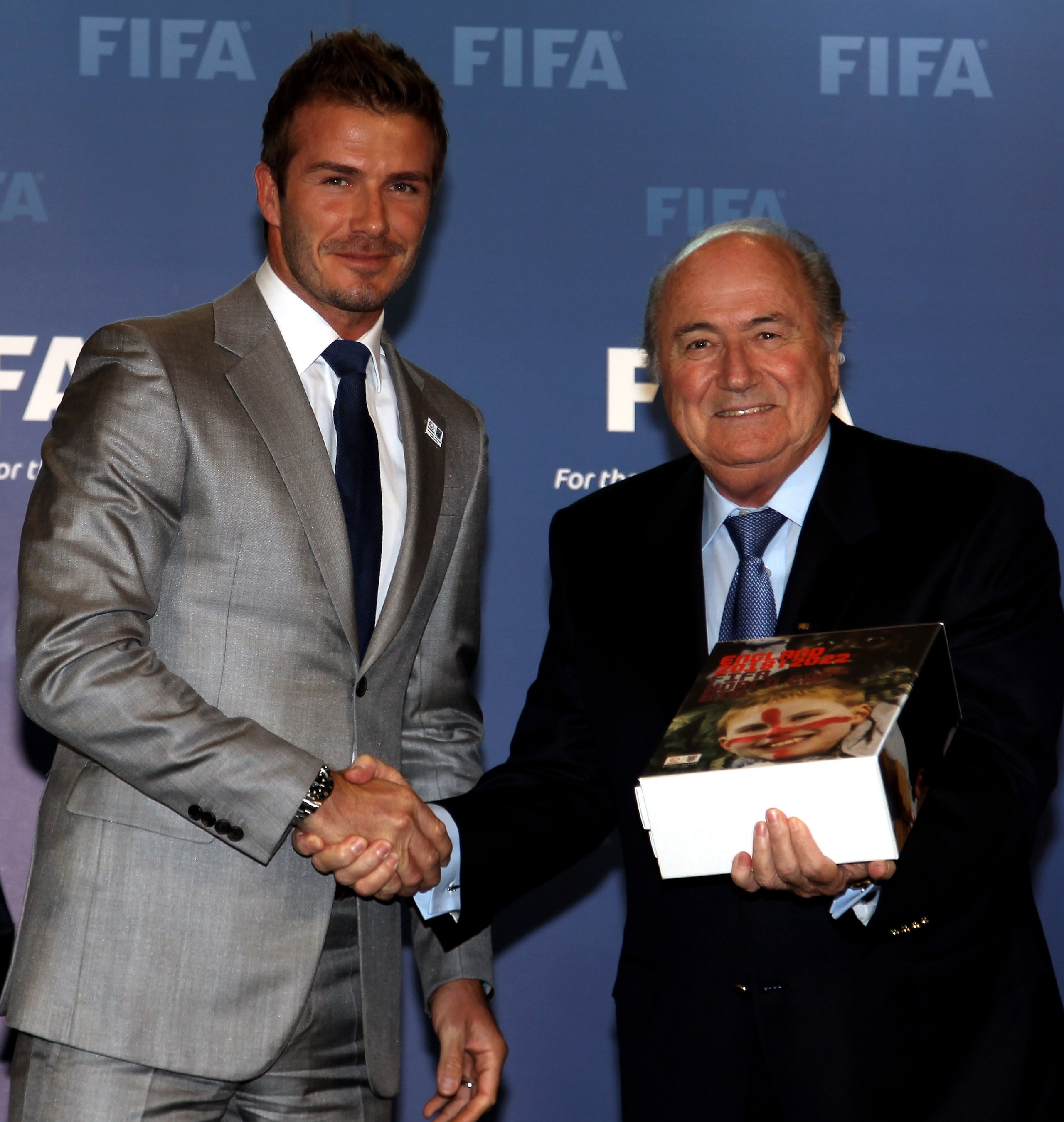 ZURICH, SWITZERLAND - MAY 14:  David Beckham, England 2018 Vice President hands England's Bid book to Sepp Blatter, President of FIFA during the 2018/2022 World Cup Bid Book Handover ceremony at FIFA Headquarters  on May 14, 2010 in Zurich, Switzerland.