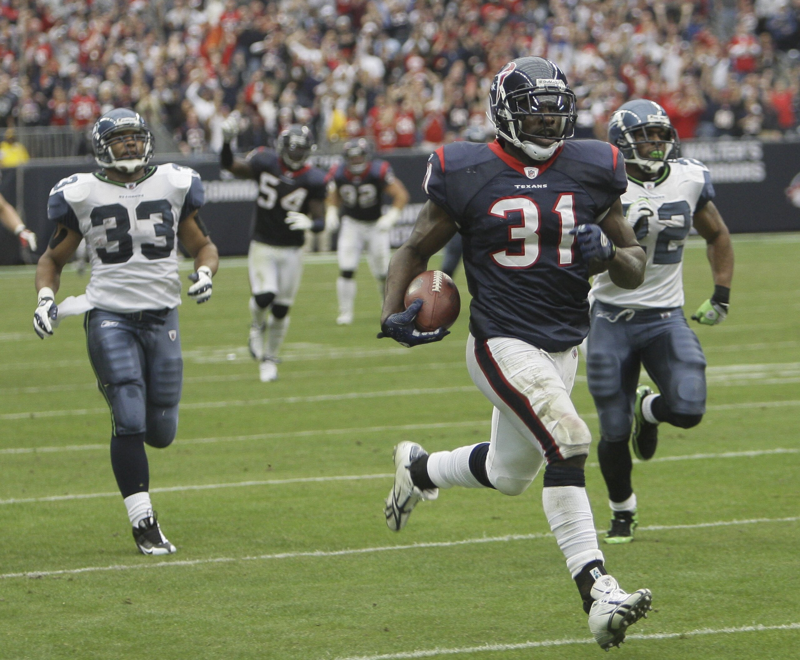 HOUSTON - DECEMBER 13:  Strong safety Bernard Pollard #31 of the Houston Texans runs back and interception 70 yards for a touchdown against the Seattle Seahawks at Reliant Stadium on December 13, 2009 in Houston, Texas.  (Photo by Bob Levey/Getty Images)