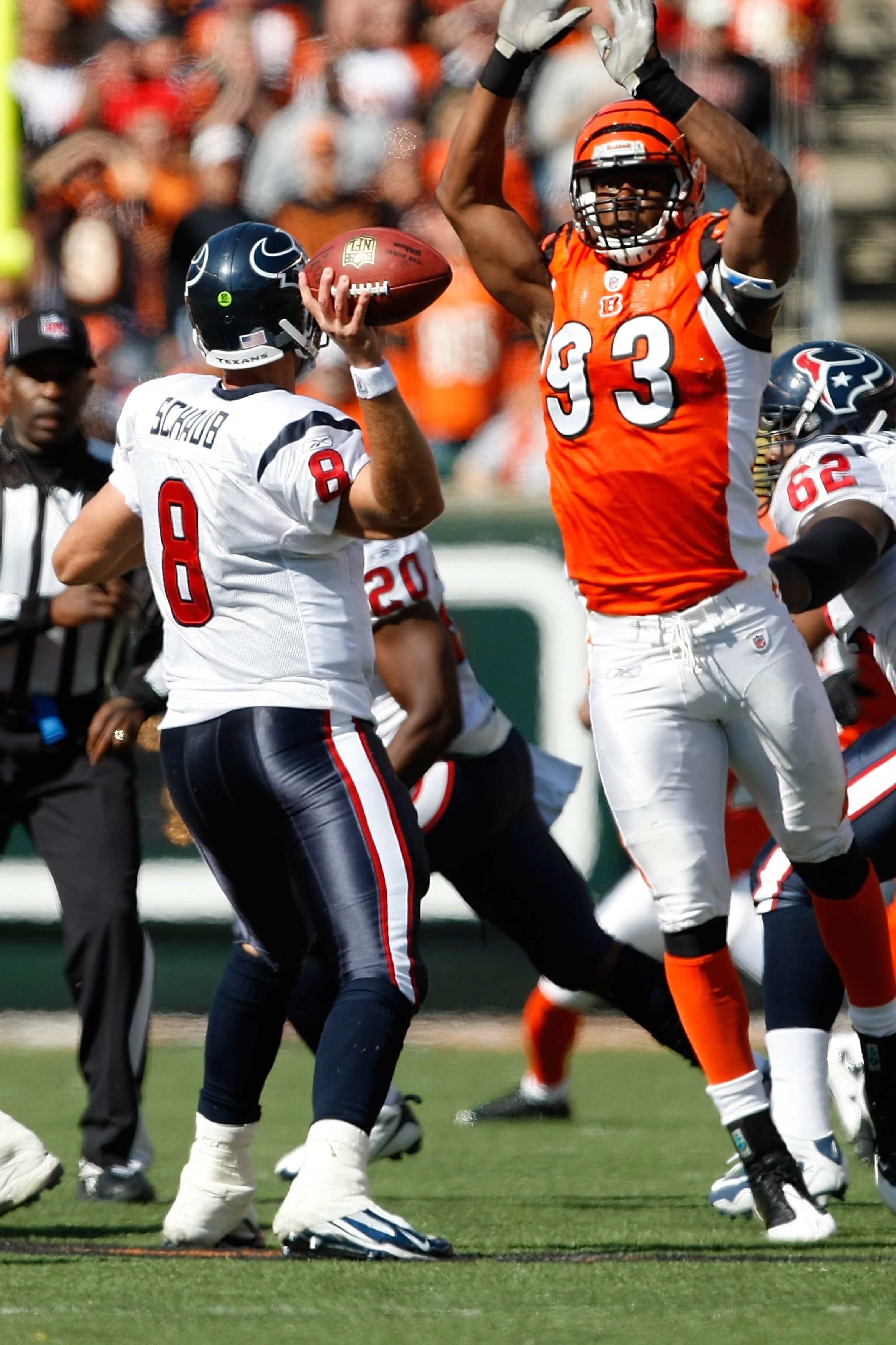 CINCINNATI, OH - OCTOBER 18: Quarterback Matt Schaub #8 of the Houston Texans passes the football as defensive end Michael Johnson #93 of the Cincinnati Bengals jumps in the air as he attempts to block the pass at Paul Brown Stadium on October 18, 2009 in