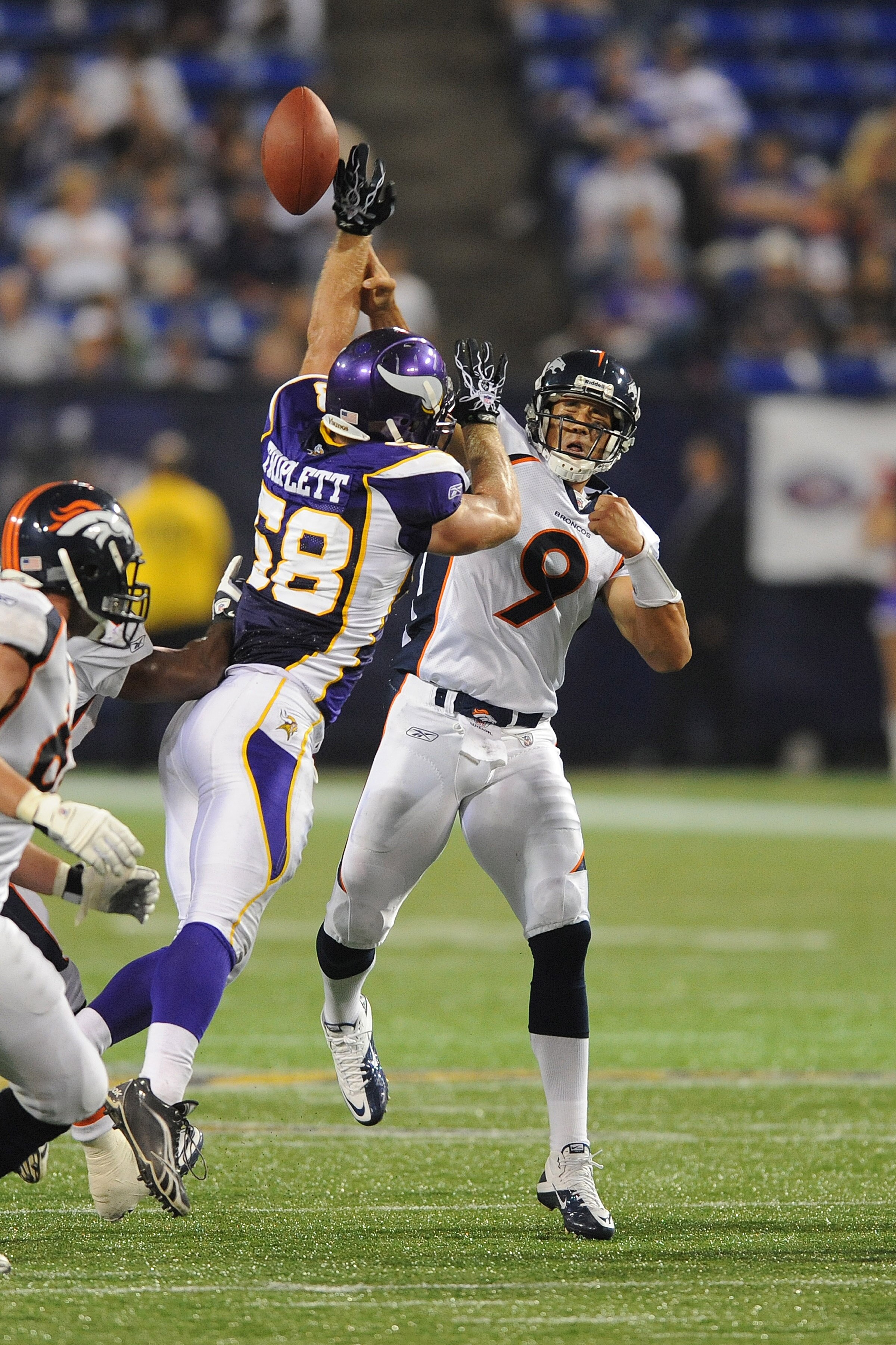 MINNEAPOLIS - SEPTEMBER 02:  Brady Quinn #9 of the Denver Broncos passes the ball as Nate Triplett #58 of the Minnesota Vikings defends during an NFL preseason game at the Mall of America Field at Hubert H. Humphrey Metrodome, on September 2, 2010 in Minn