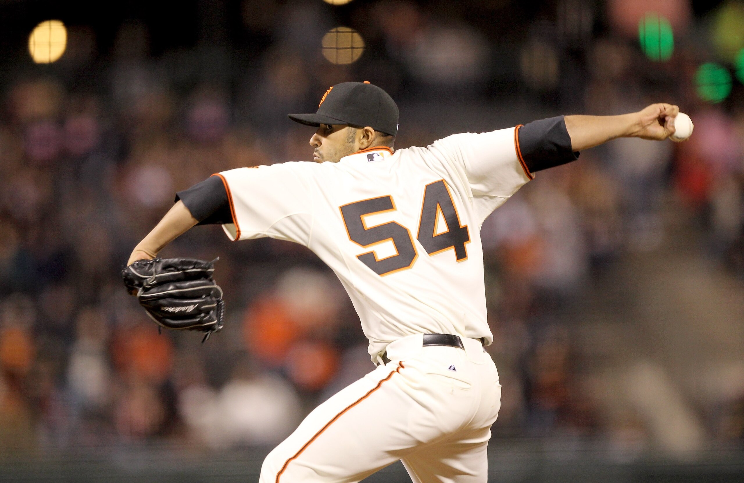 SAN FRANCISCO - APRIL 12:  Sergio Romo #54 of the San Francisco Giants pitches against the Pittsburgh Pirates at AT&T Park on April 12, 2010 in San Francisco, California.  (Photo by Ezra Shaw/Getty Images)