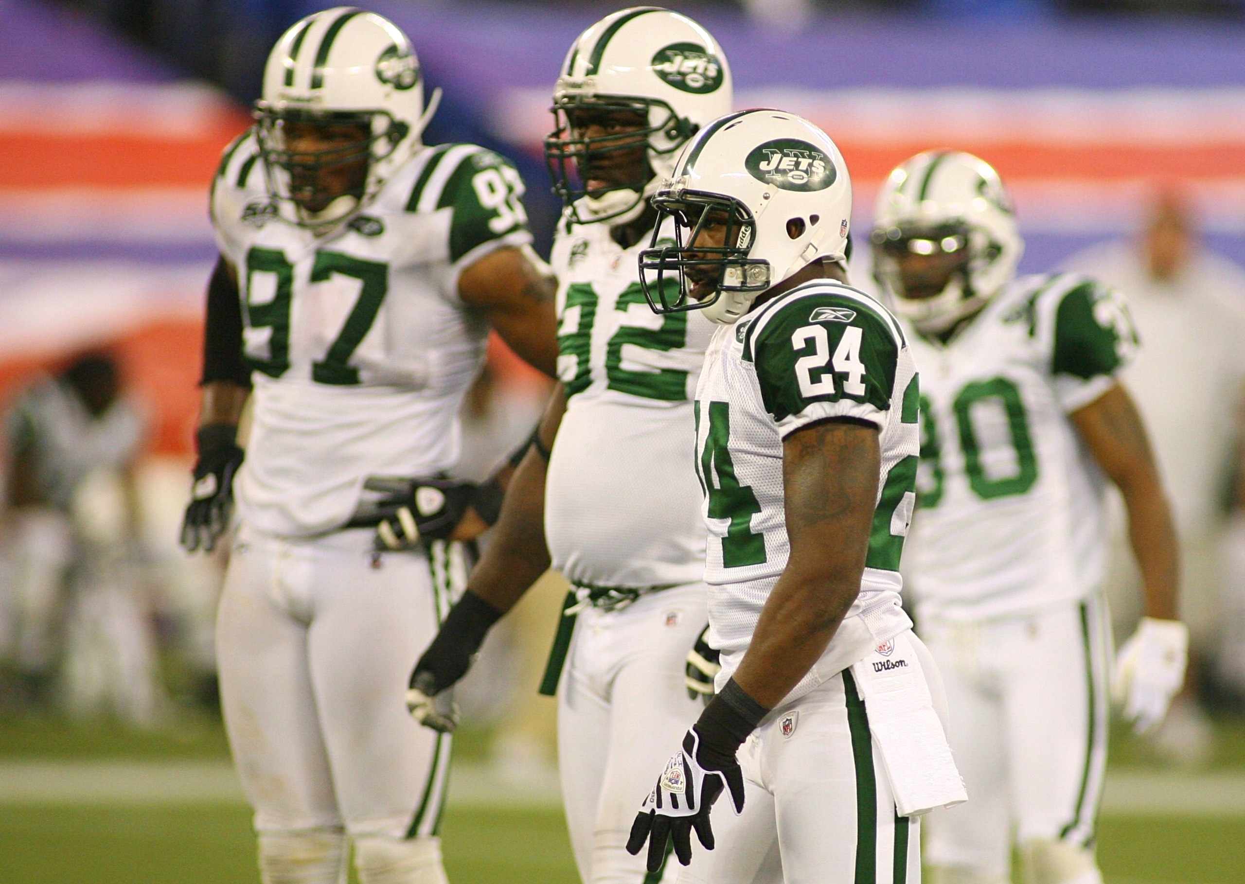 TORONTO - DECEMBER 3: Darrelle Revis #24, Shaun Ellis #92 and Calvin Pace #97 of the New York Jets gets set on defense against the Buffalo Bills at Rogers Centre on December 3, 2009 in Toronto, Canada. The Jets won 19-16.  (Photo by Rick Stewart/Getty Ima