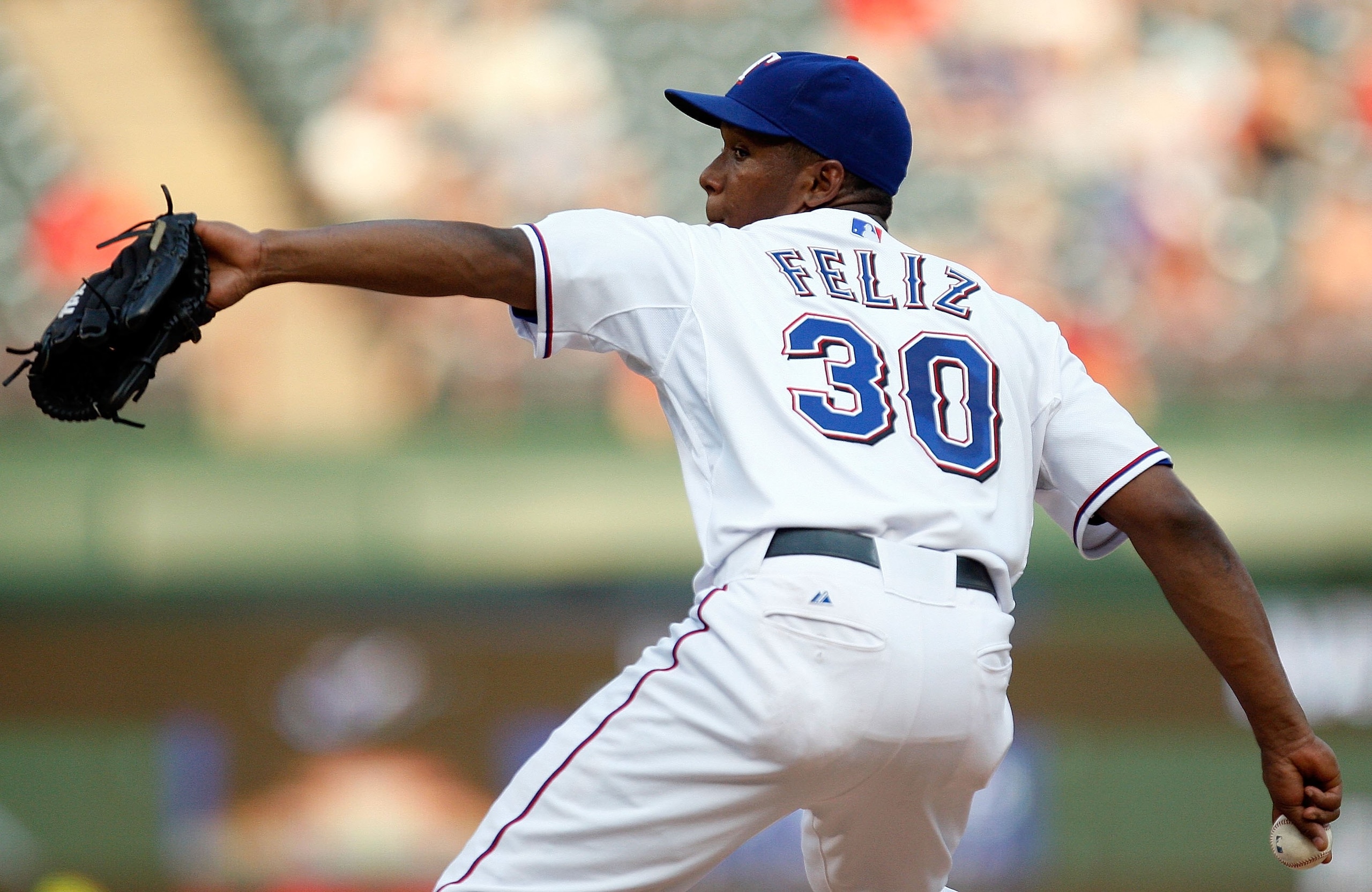 ARLINGTON, TX - SEPTEMBER 01:  Pitcher Neftali Feliz #30 of the Texas Rangers throws against the Toronto Blue Jays on September 1, 2009 at Rangers Ballpark in Arlington, Texas.  (Photo by Ronald Martinez/Getty Images)