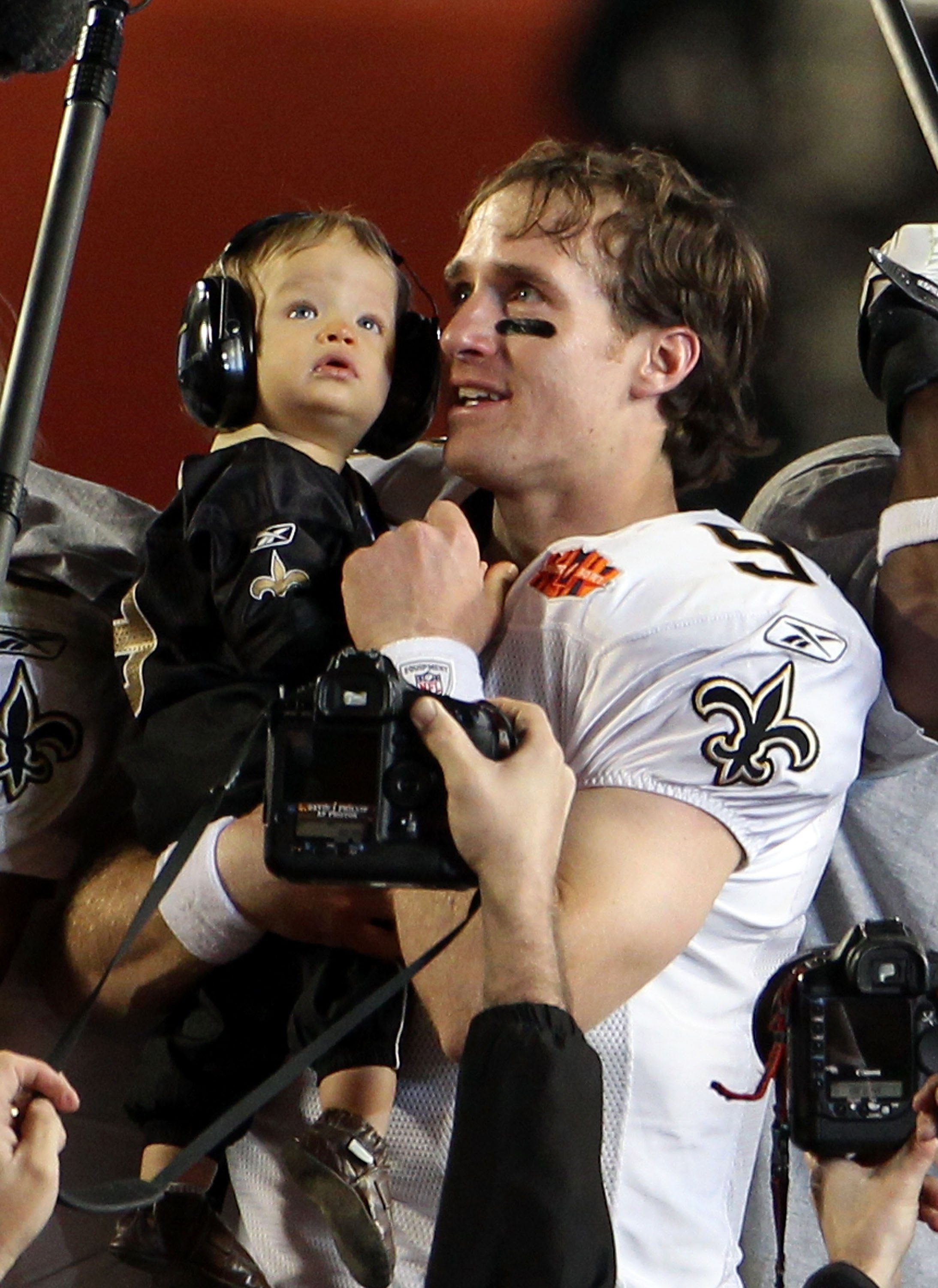 MIAMI GARDENS, FL - FEBRUARY 07:  Drew Brees #9 of the New Orleans Saints holds his son Baylen Brees to celebrate after the Saints defeated the Indianapolis Colts during Super Bowl XLIV on February 7, 2010 at Sun Life Stadium in Miami Gardens, Florida.  (