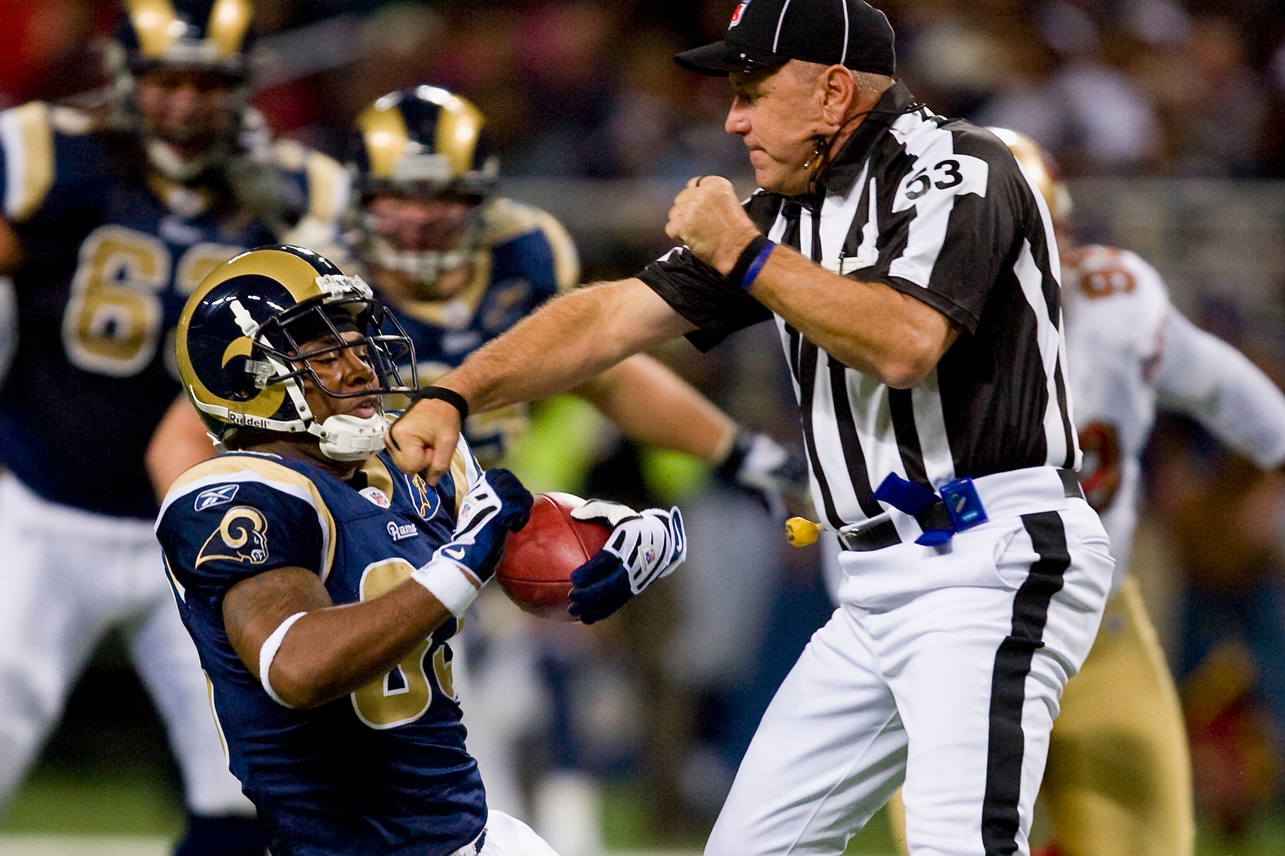 ST. LOUIS, MO - DECEMBER 21: Kenneth Darby #33 of the St. Louis Rams runs into umpire Garth DeFelice #53 against the San Francisco 49ers at the Edward Jones Dome on December 21, 2008 in St. Louis, Missouri.  The 49ers beat the Rams 17-16.  (Photo by Dilip