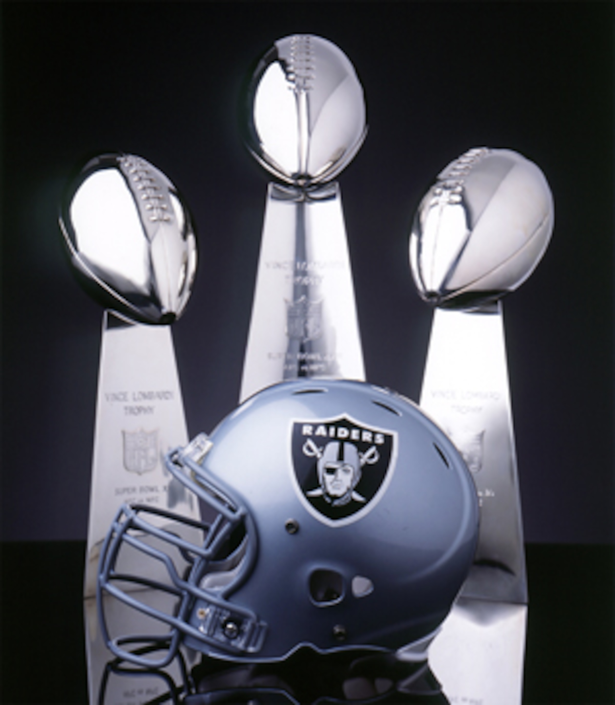 Lombardi trophies from Super Bowls XI, XV, and XVIII