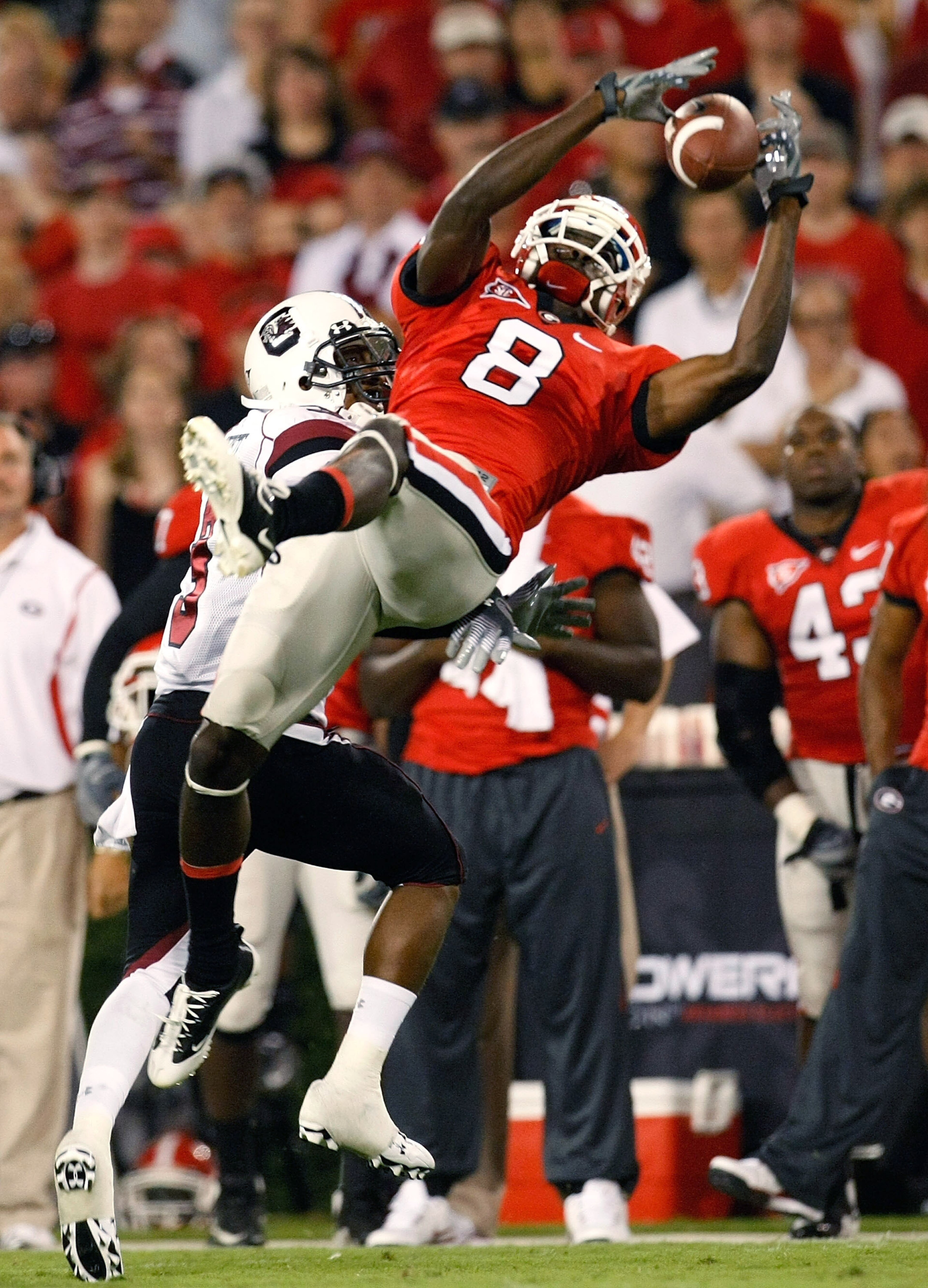 ATHENS, GA - SEPTEMBER 12: A.J. Green #8 of the Georgia Bulldogs pulls in this reception against Akeem Auguste #3 of the South Carolina Gamecocks at Sanford Stadium on September 12, 2009 in Athens, Georgia. (Photo by Kevin C. Cox/Getty Images) ATHENS, GA - SEPTEMBER 12: A.J. Green #8 of the Georgia Bulldogs pulls in this reception against Akeem Auguste #3 of the South Carolina Gamecocks at Sanford Stadium on September 12, 2009 in Athens, Georgia. (Photo by Kevin C. Cox/Getty Images)