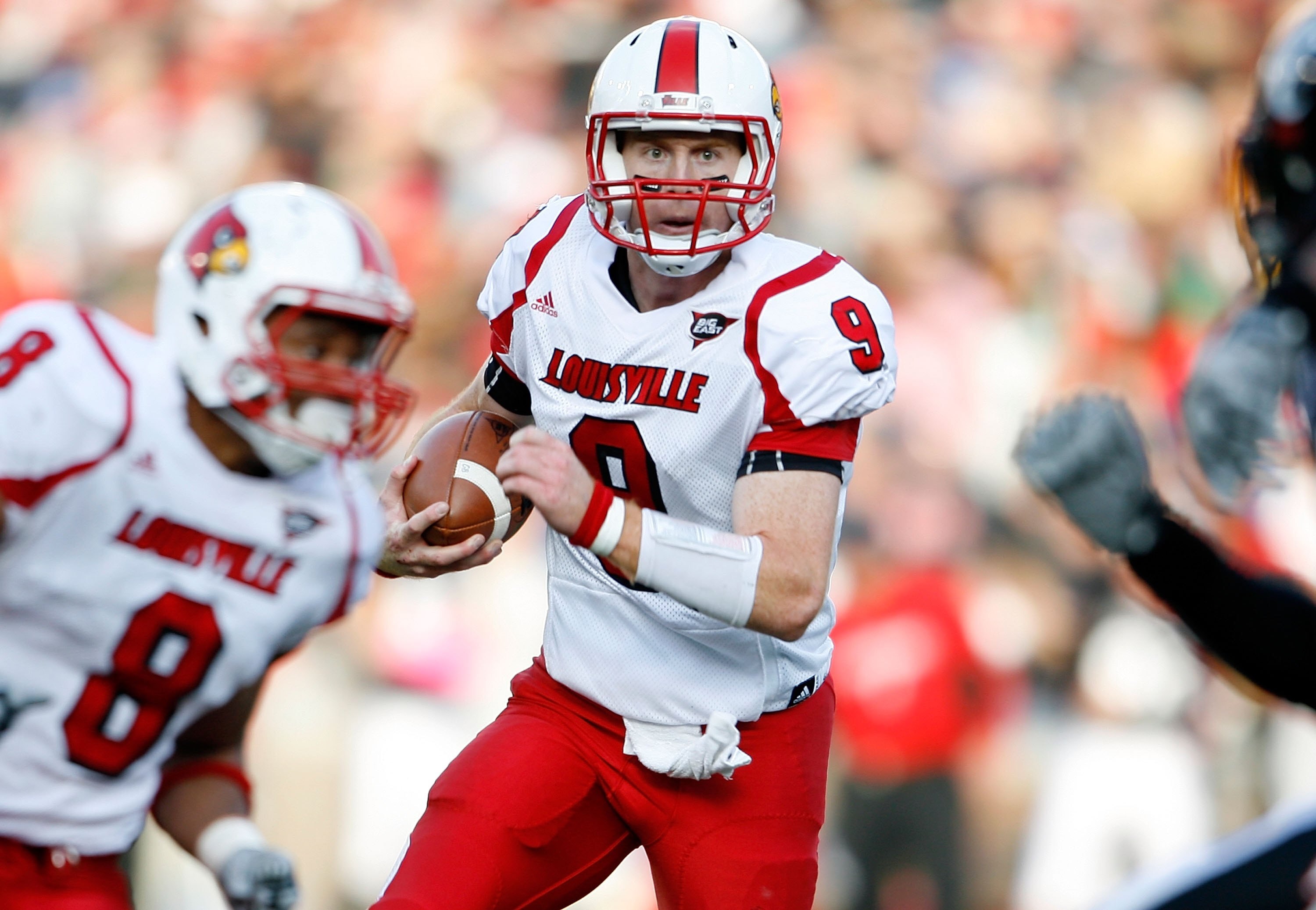 CINCINNATI - OCTOBER 24:  Adam Froman #9 of the Louisville Cardinals runs with the ball during the Big East Conference game against the Cincinnati Bearcats at Nippert Stadium on October 24, 2009 in Cincinnati, Ohio.  (Photo by Andy Lyons/Getty Images)