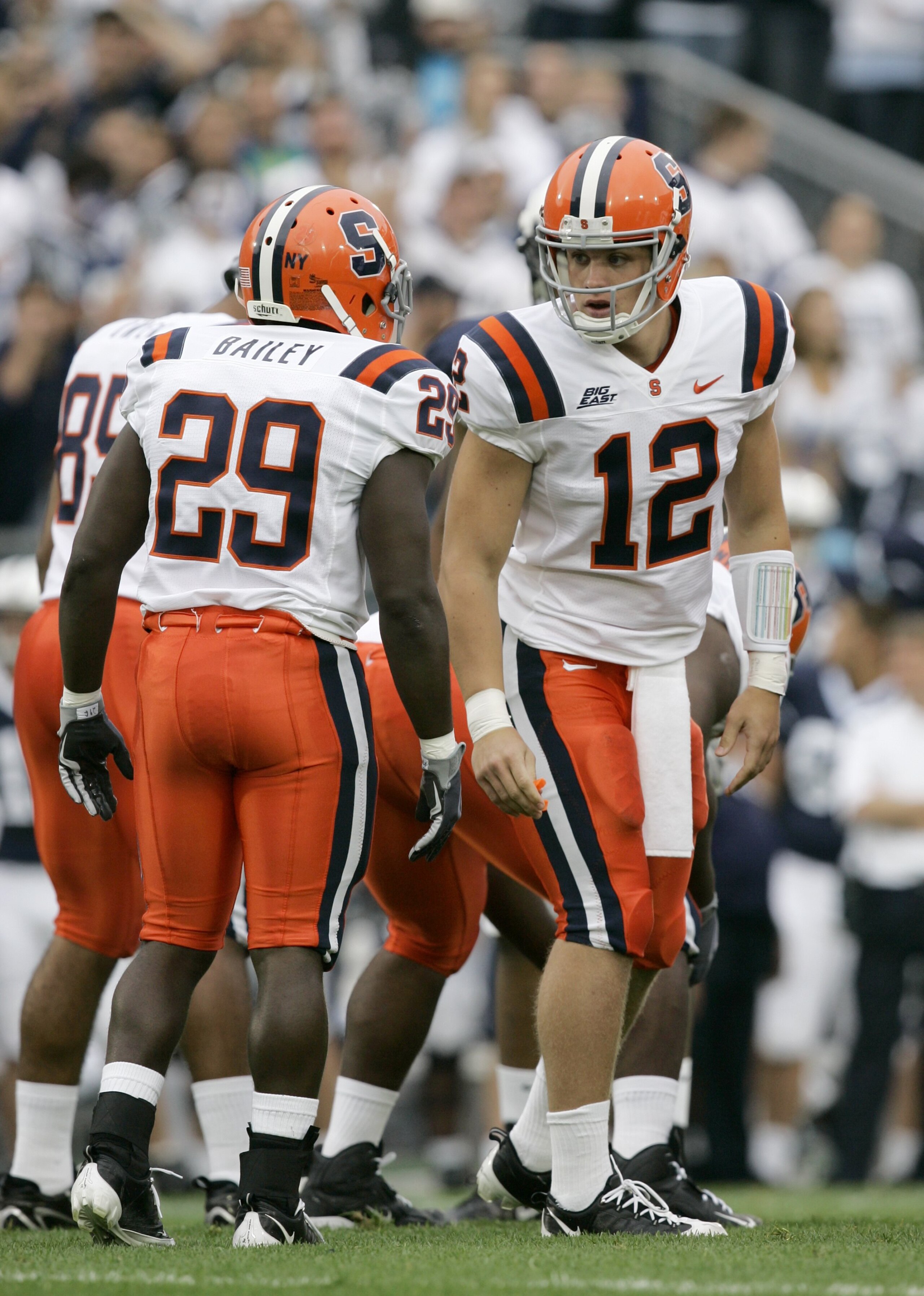 STATE COLLEGE, PA - SEPTEMBER 12: Quarterback Ryan Nassib #12 of the Syracuse Orangemen talks to running back Antwon Bailey #29 during the first half against the Penn State Nittany Lions at Beaver Stadium  September 12, 2009 in State College, Pennsylvania