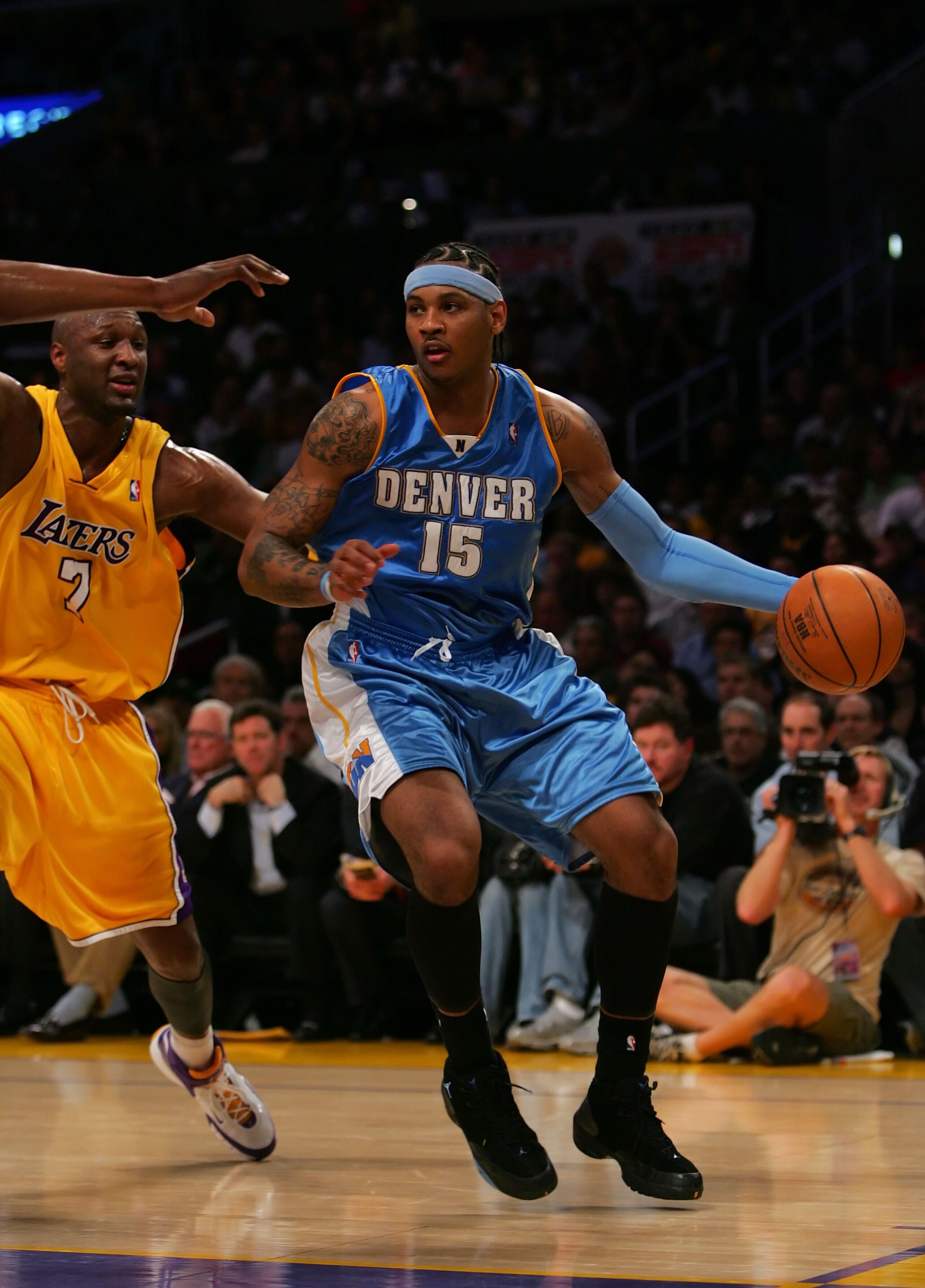 LOS ANGELES - APRIL 3:  Carmello Anthony #15 of the Denver Nuggets drives against Lamar Odom #7 of the Los Angeles Lakers at Staples Center April 3, 2007 in Los Angeles, California.  NOTE TO USER: User expressly acknowledges and agrees that, by downloadin