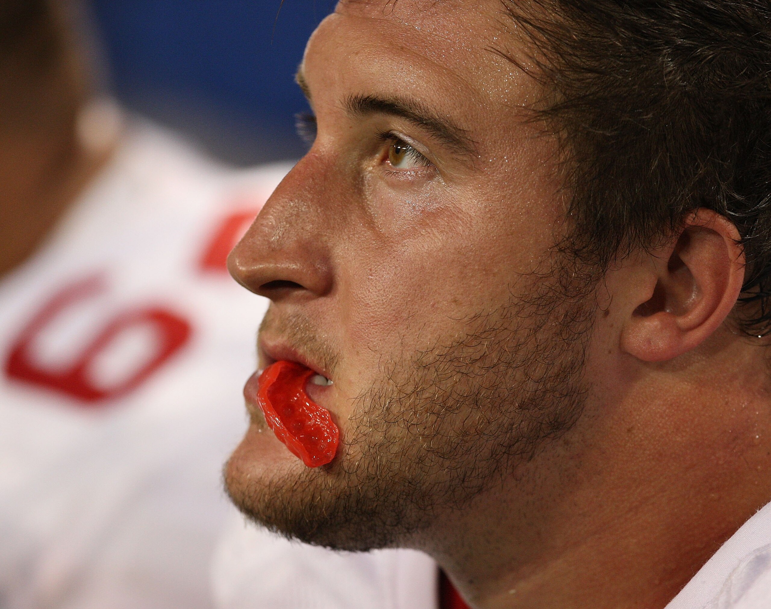 MINNEAPOLIS - SEPTEMBER 27: Joe Staley #74 of the San Francisco 49erschews on his mouth piece while sitting on the bench during a game against the Minnesota Vikings at the Hubert H. Humphrey Metrodome on September 27, 2009 in Minneapolis, Minnesota. The V