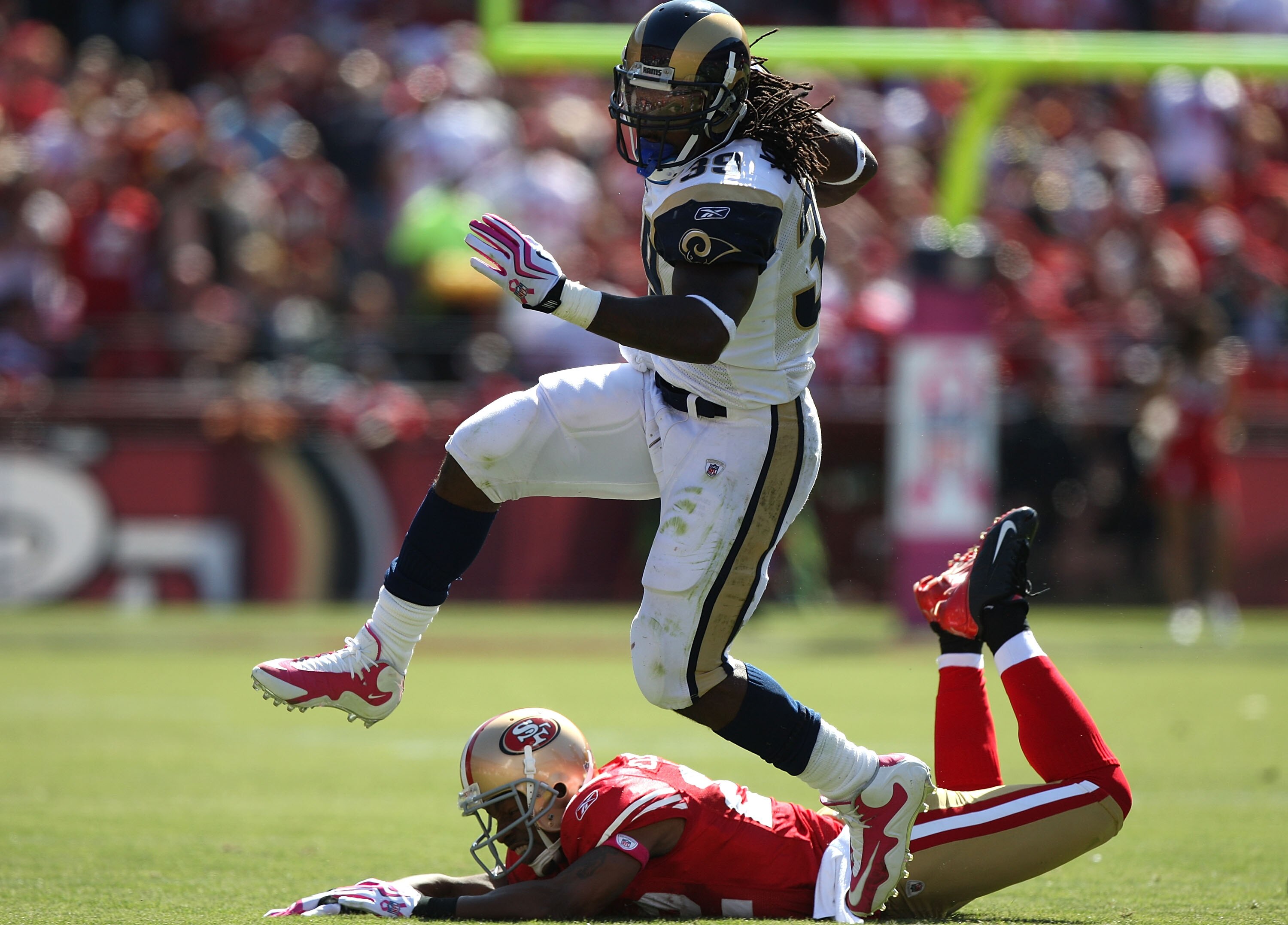 SAN FRANCISCO - OCTOBER 04: Steven Jackson #39 of the the St. Louis Rams runs against Nate Clements #22 of the San Francisco 49ers during an NFL game on October 4, 2009 at Candlestick Park in San Francisco, California. (Photo by Jed Jacobsohn/Getty Imag SAN FRANCISCO - OCTOBER 04: Steven Jackson #39 of the the St. Louis Rams runs against Nate Clements #22 of the San Francisco 49ers during an NFL game on October 4, 2009 at Candlestick Park in San Francisco, California. (Photo by Jed Jacobsohn/Getty Imag