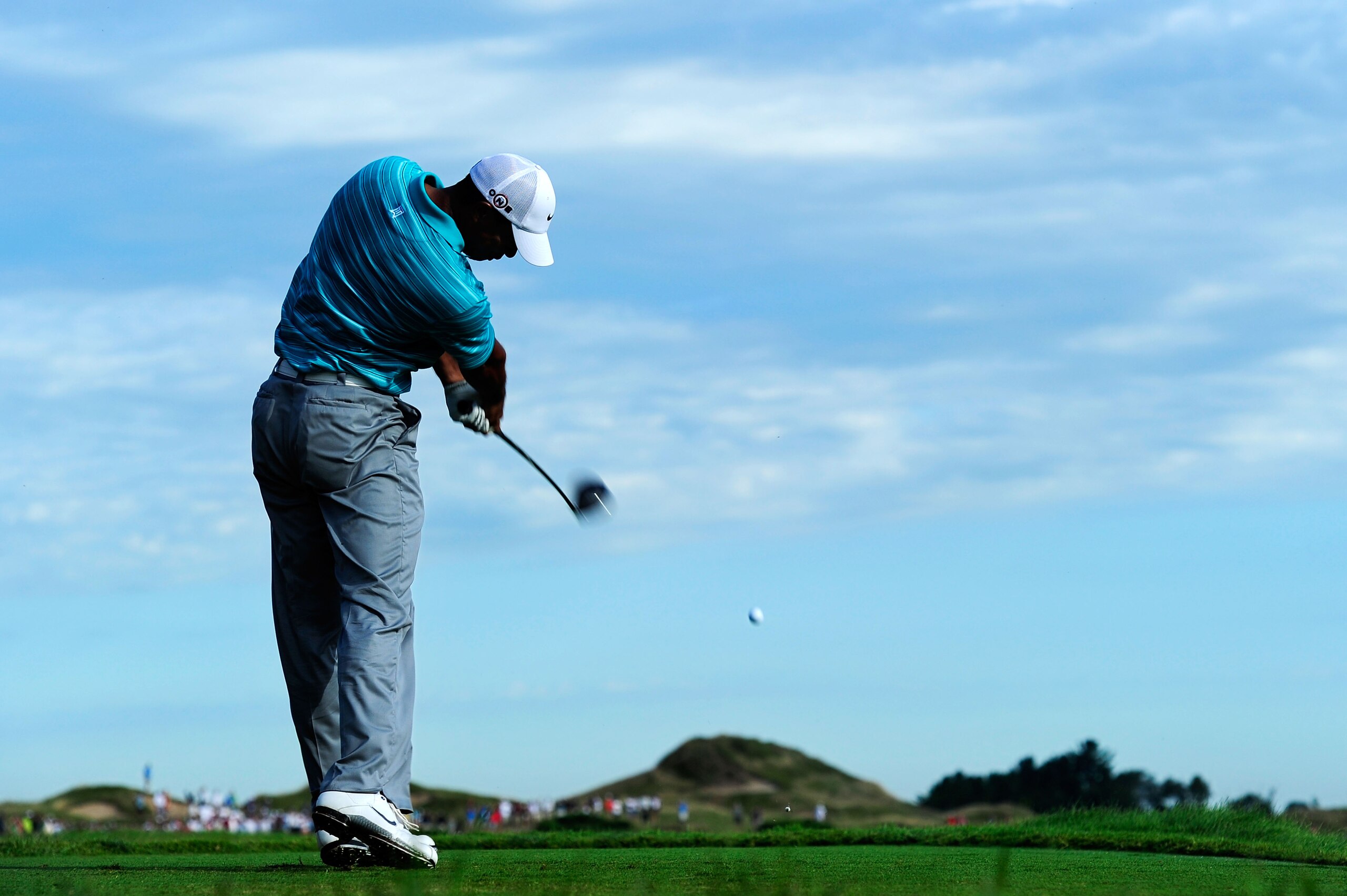 KOHLER, WI - AUGUST 14:  Tiger Woods hits his tee shot on the 11th hole during the continuation of the second round of the 92nd PGA Championship on the Straits Course at Whistling Straits on August 14, 2010 in Kohler, Wisconsin.  (Photo by Stuart Franklin