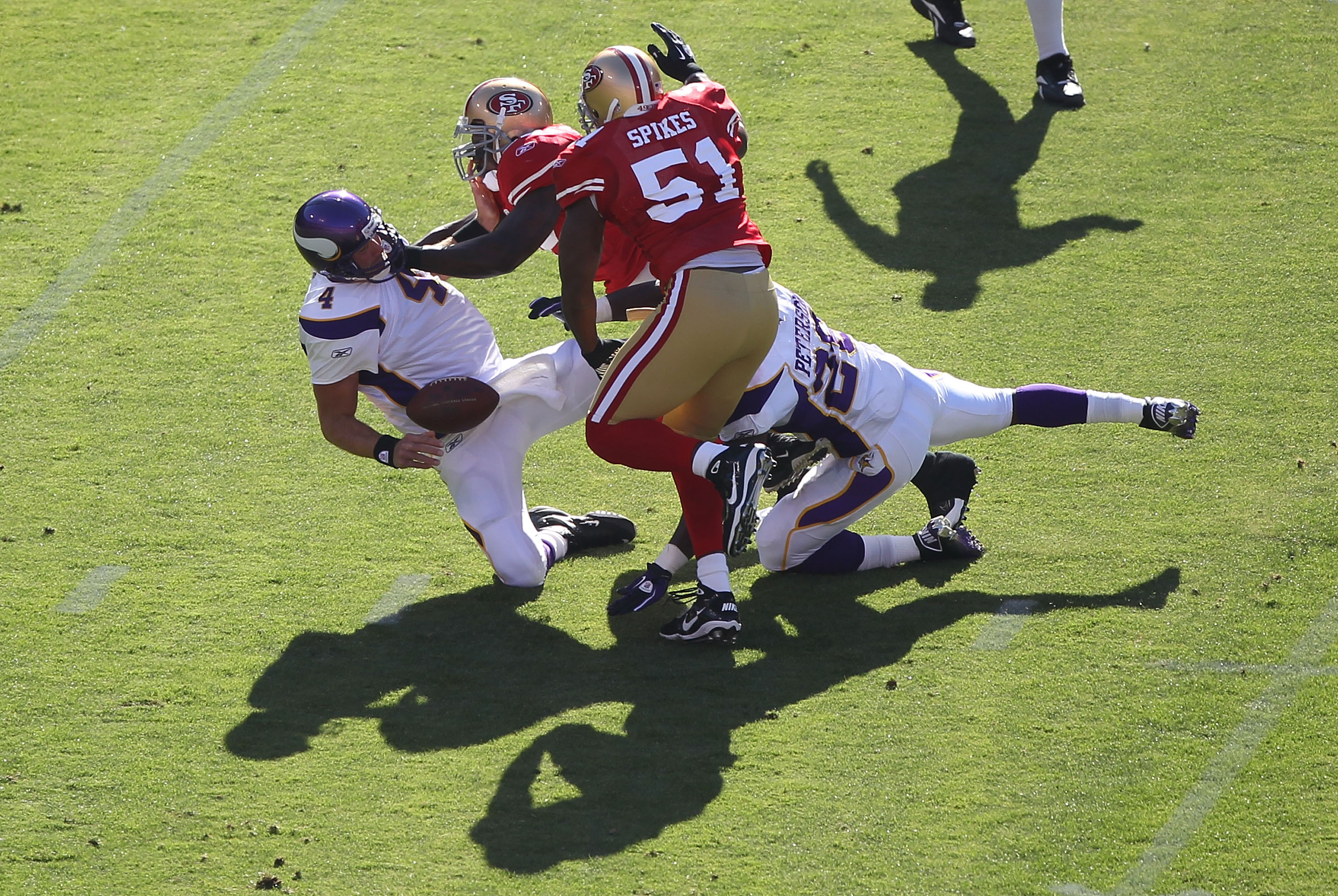 SAN FRANCISCO - AUGUST 22: Brett Favre #4 of the Minnesota Vikings is sacked by Patrick Willis #52 and Takeo Spikes #51 of the San Francisco 49ers during an NFL pre-season game at Candlestick Park on August 22, 2010 in San Francisco, California. (Photo SAN FRANCISCO - AUGUST 22: Brett Favre #4 of the Minnesota Vikings is sacked by Patrick Willis #52 and Takeo Spikes #51 of the San Francisco 49ers during an NFL pre-season game at Candlestick Park on August 22, 2010 in San Francisco, California. (Photo