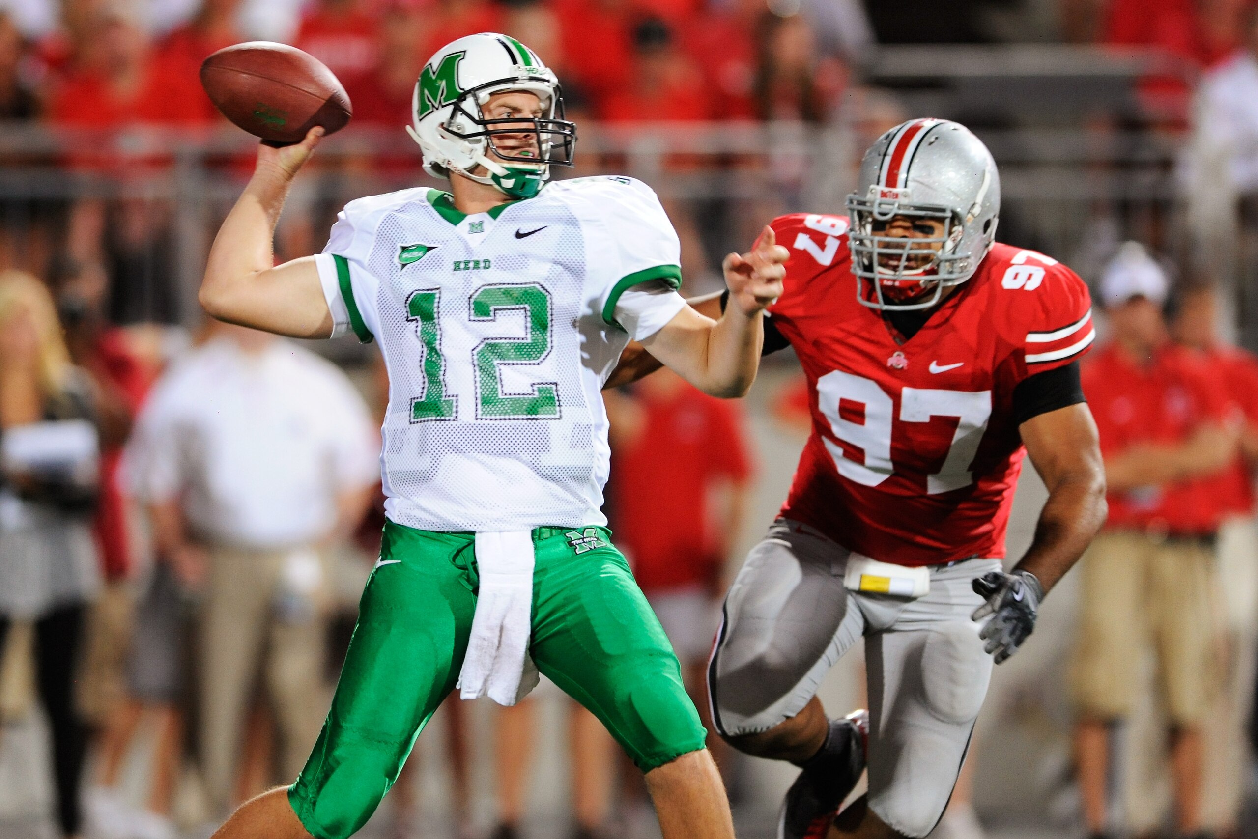 COLUMBUS, OH - SEPTEMBER 2:  Quarterback Brian Anderson #12 of the Marshall Thundering Herd attempts a pass as Cameron Heyward #97 of the Ohio State Buckeyes closes in at Ohio Stadium on September 2, 2010 in Columbus, Ohio.  (Photo by Jamie Sabau/Getty Im
