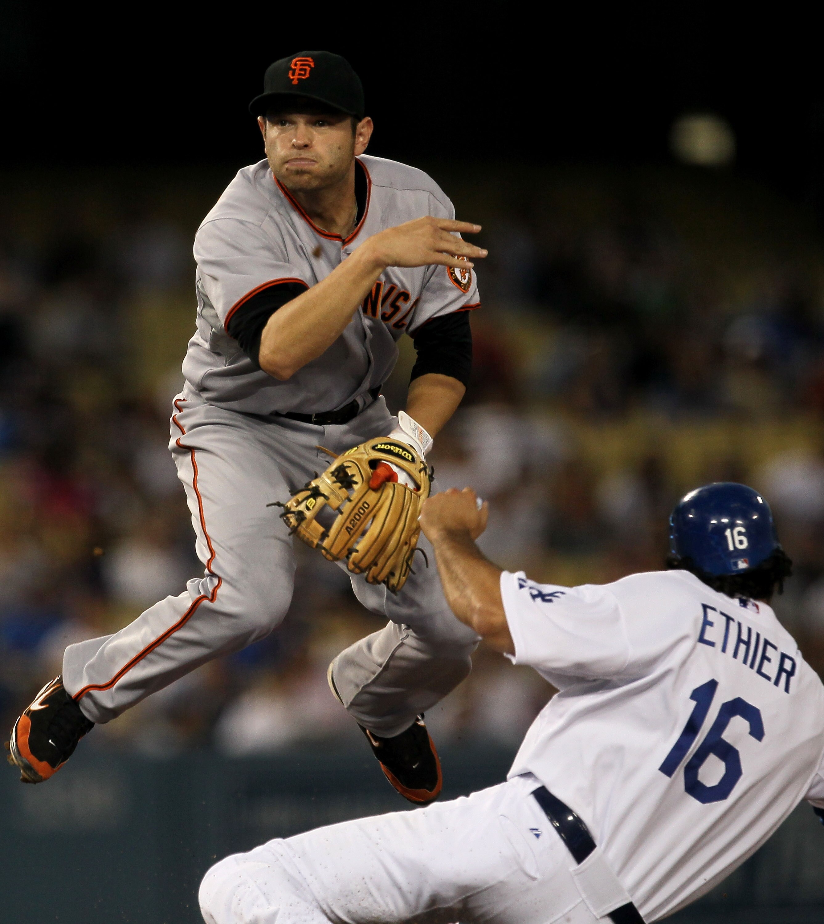 LOS ANGELES, CA - SEPTEMBER 03:  Second baseman Freddy Sanchez #21 of the San Francisco Giants throws to first to complete a double play after forcing out Andre Ethier #16 of the Los Angeles Dodgers in the first inning on September 3, 2010 at Dodger Stadi