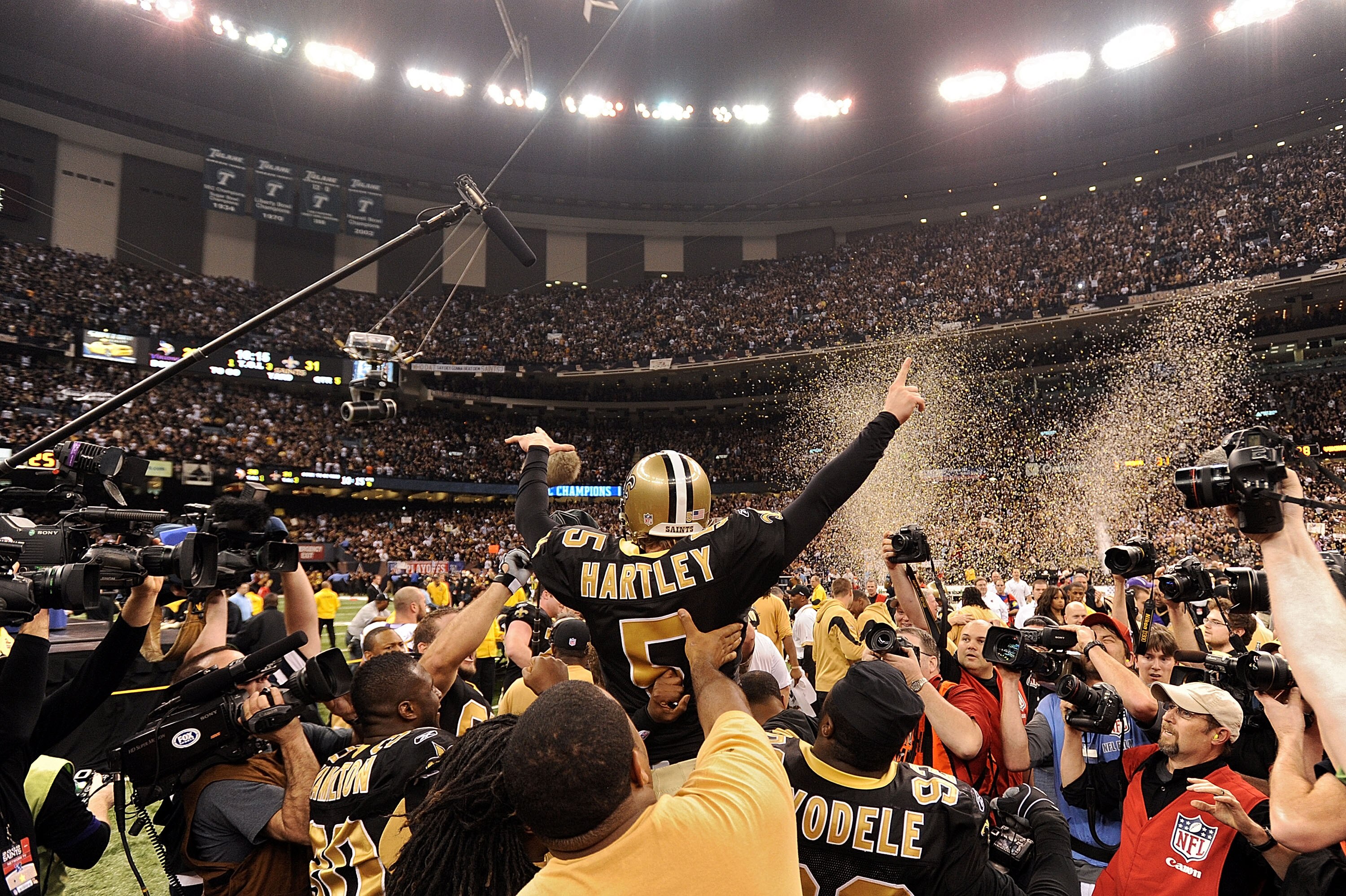 NEW ORLEANS - JANUARY 24:  Kicker Garrett Hartley #5 of the New Orleans Saints is mobbed by teammates after hitting a gaming winning field goal in overtime against the Minnesota Vikings to win the NFC Championship Game at the Louisiana Superdome on Januar