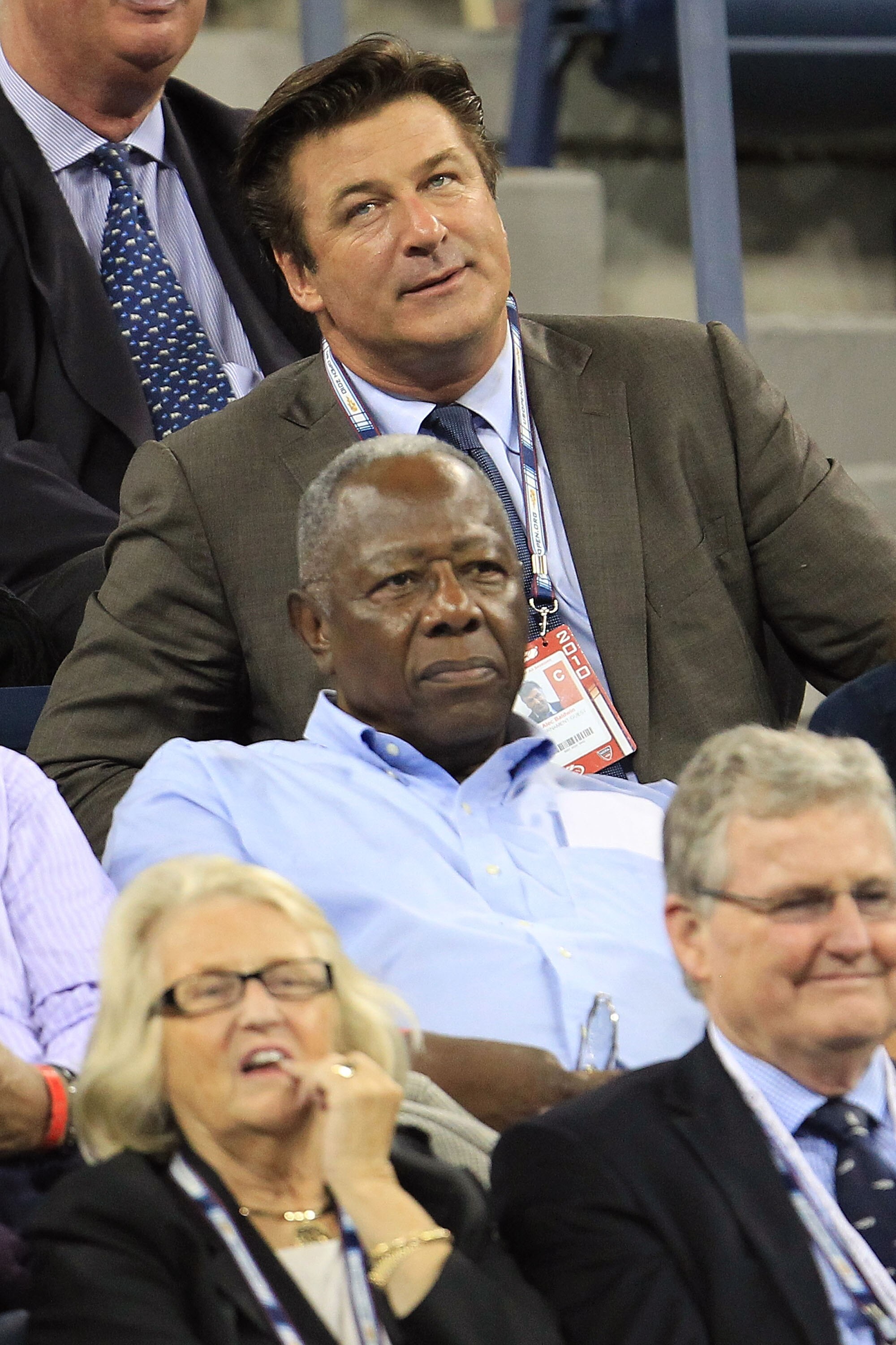NEW YORK - SEPTEMBER 07:  Actor Alec Baldwin a (top) and baseball Hall of Famer Hank Aaron (C) attend the women's singles match between Samantha Stosur of Australia and Kim Clijsters of Belgium during day nine of the 2010 U.S. Open at the USTA Billie Jean