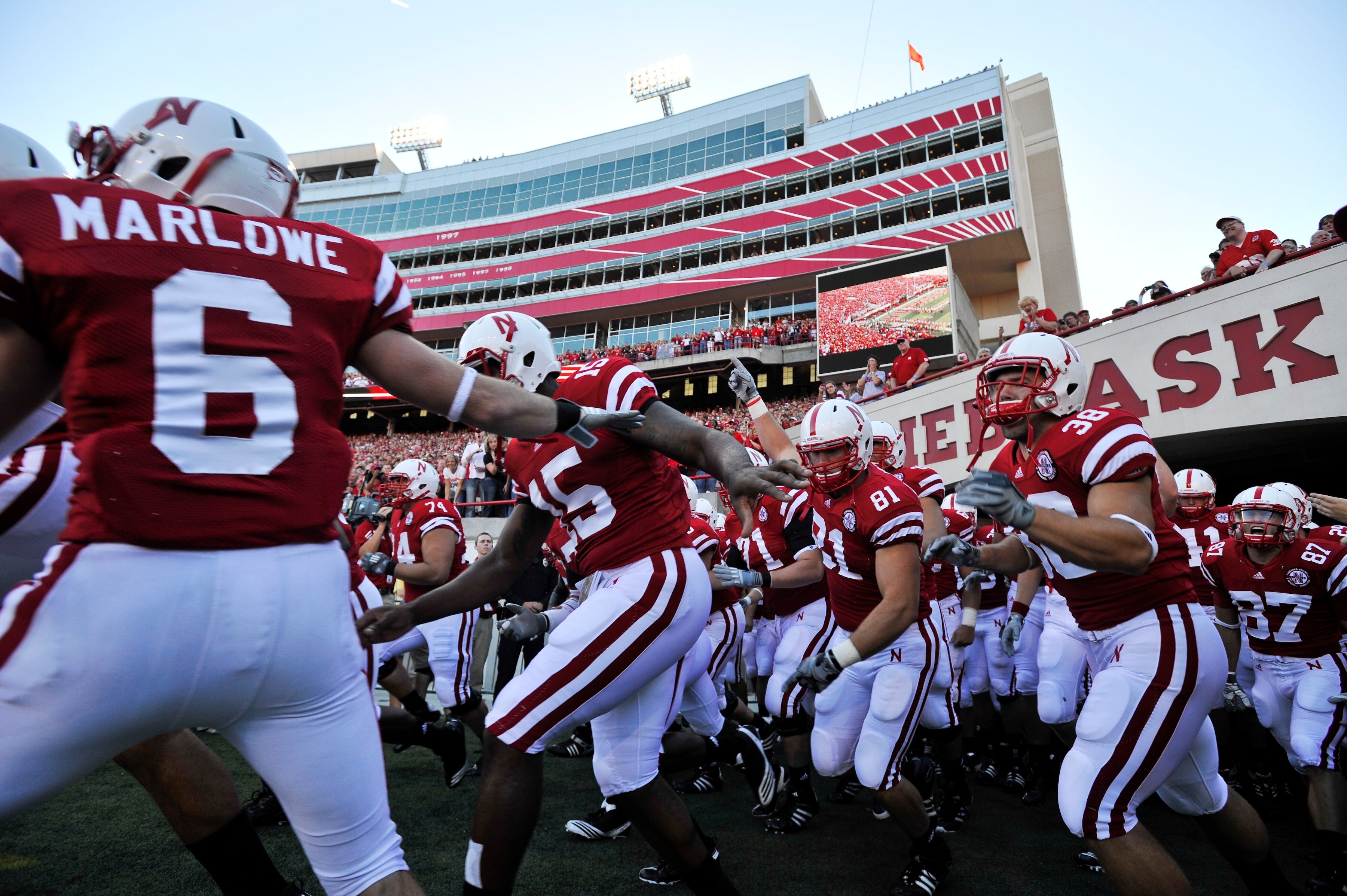 LINCOLN, NE - SEPTEMBER 04:  The Nebraska Cornhuskers run on to the field before their season opener against the Western Kentucky Hilltoppers at Memorial Stadium on September 4, 2010 in Lincoln, Nebraska. Nebraska defeated Western Kentucky 49-10. (Photo b