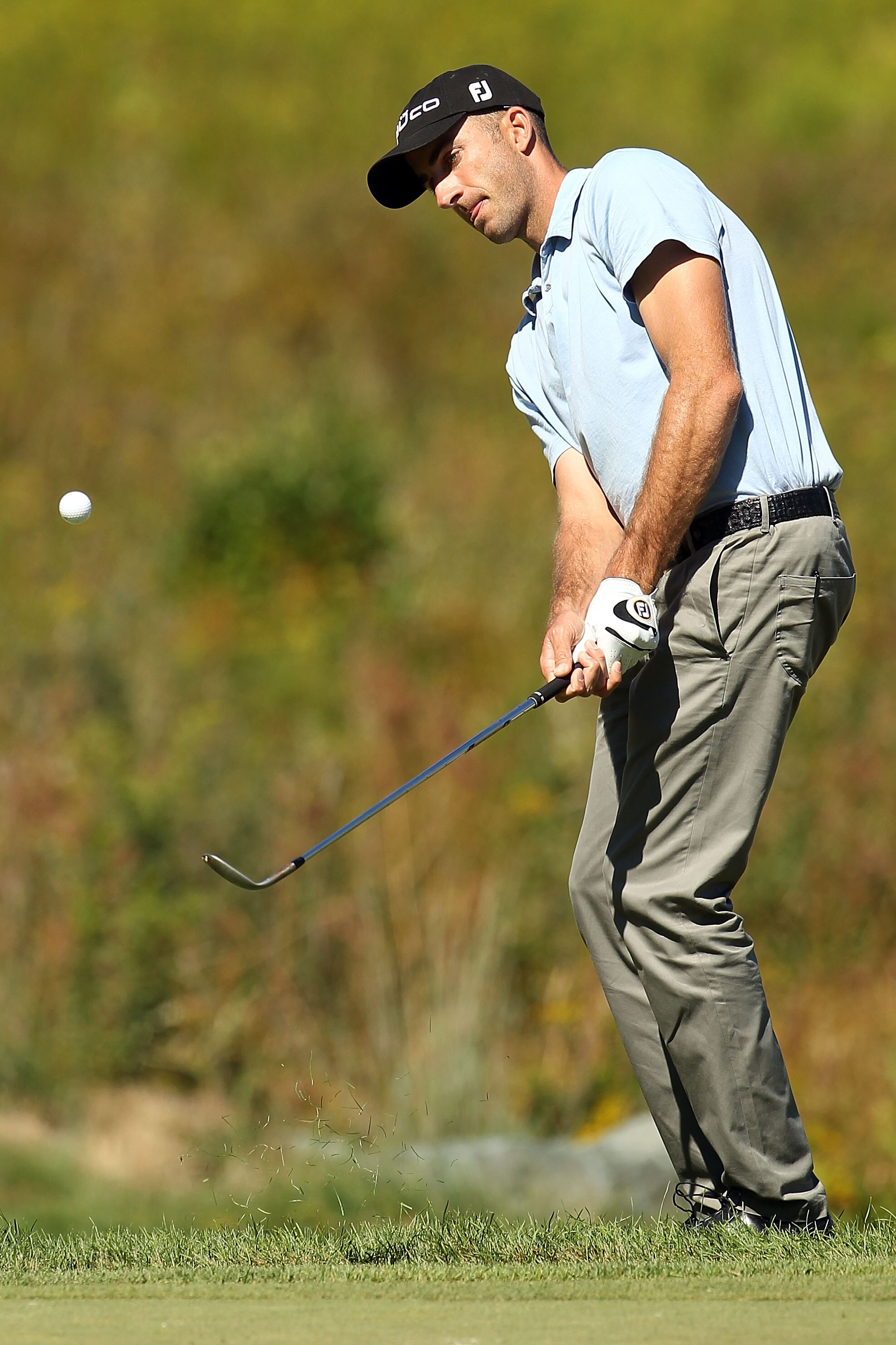 NORTON, MA - SEPTEMBER 06:  Geoff Ogilvy of Australia chips the ball on the third hole during the final round of the Deutsche Bank Championship at TPC Boston on September 6, 2010 in Norton, Massachusetts.  (Photo by Mike Ehrmann/Getty Images)