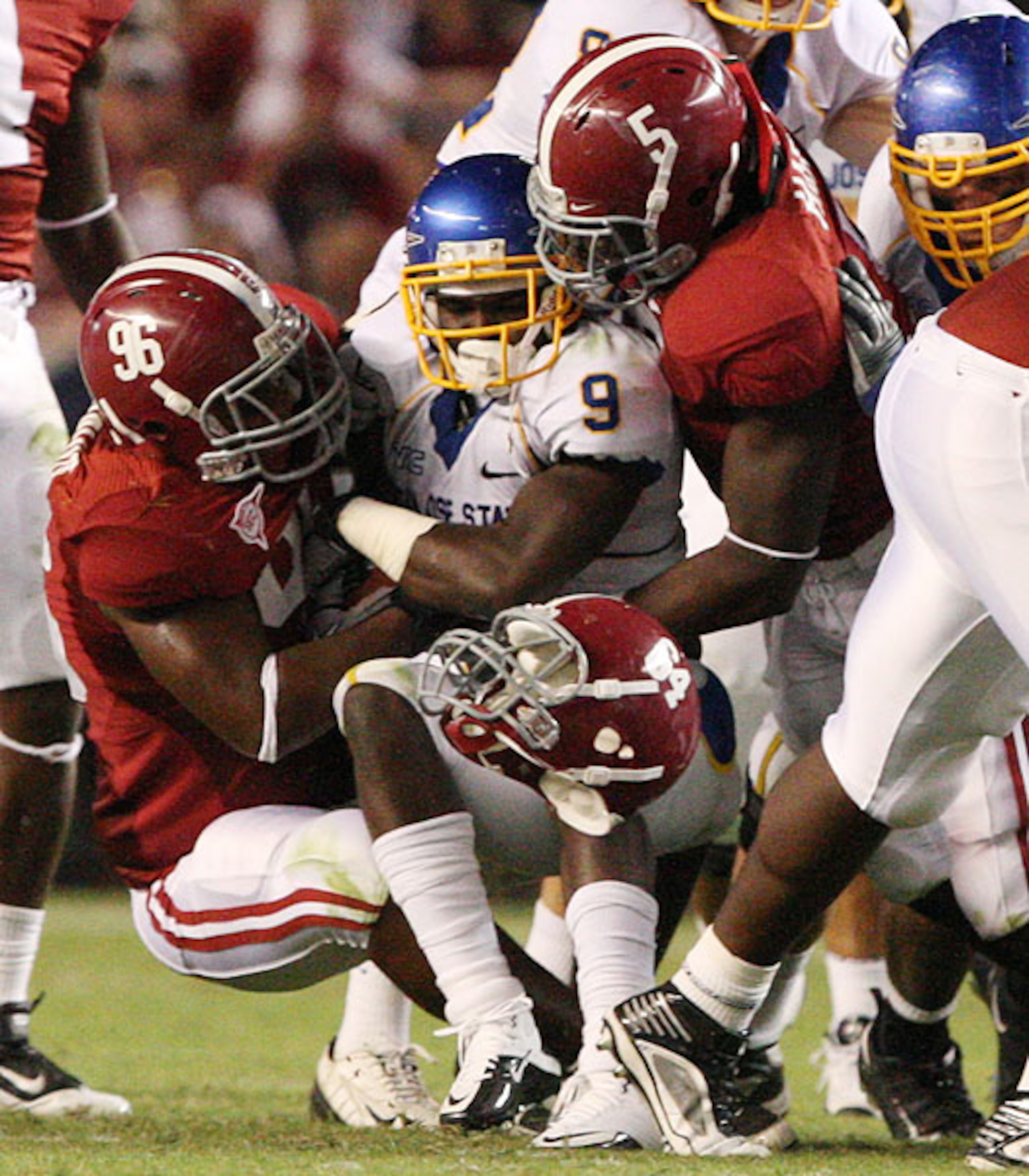 DE Darrington Sentimore, LB Jerrell Harris and helmet of Kerry Murphy