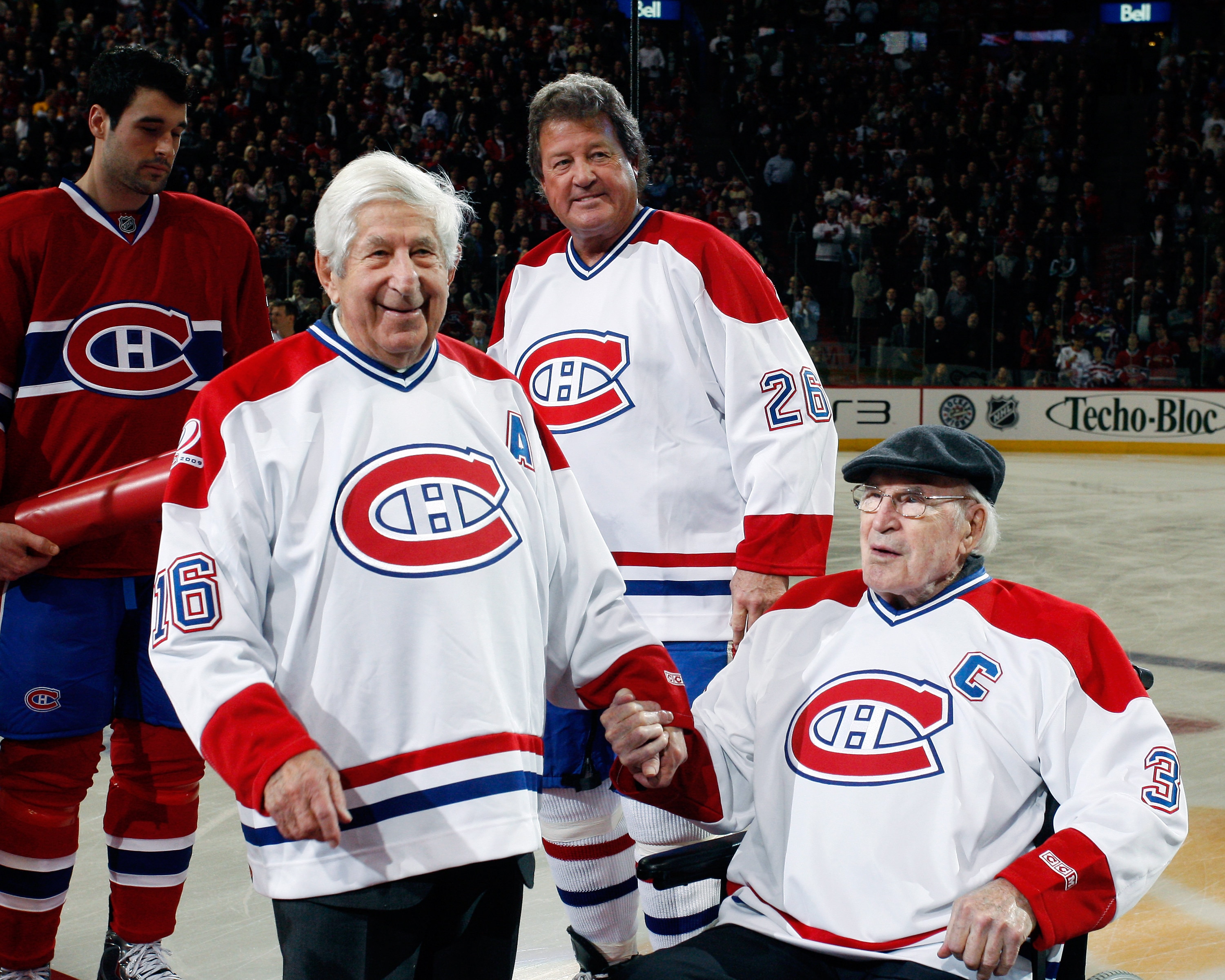 MONTREAL- DECEMBER 4:  Former Montreal Canadiens Elmer Lach and Emile Bouchard are honored by having their numbers retired during the Centennial Celebration ceremonies prior to the NHL game between the Montreal Canadiens and Boston Bruins on December 4, 2