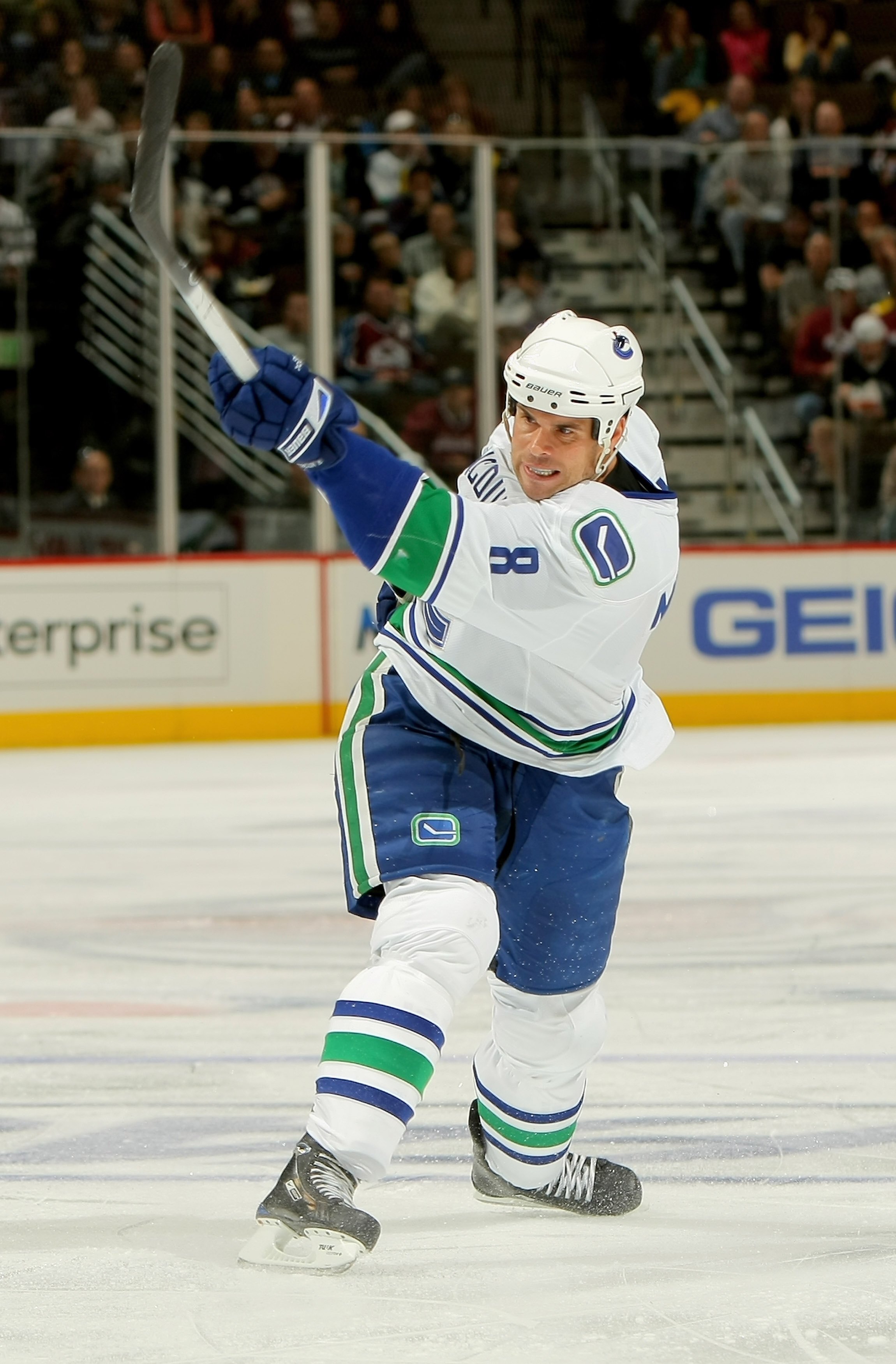 DENVER - OCTOBER 03: Willie Mitchell #8 of the Vancouver Canucks takes a shot against the Colorado Avalanche during NHL action at the Pepsi Center on October 3, 2009 in Denver, Colorado. The Avalanche defeated the Canucks 3-0. (Photo by Doug Pensinger/G DENVER - OCTOBER 03: Willie Mitchell #8 of the Vancouver Canucks takes a shot against the Colorado Avalanche during NHL action at the Pepsi Center on October 3, 2009 in Denver, Colorado. The Avalanche defeated the Canucks 3-0. (Photo by Doug Pensinger/G
