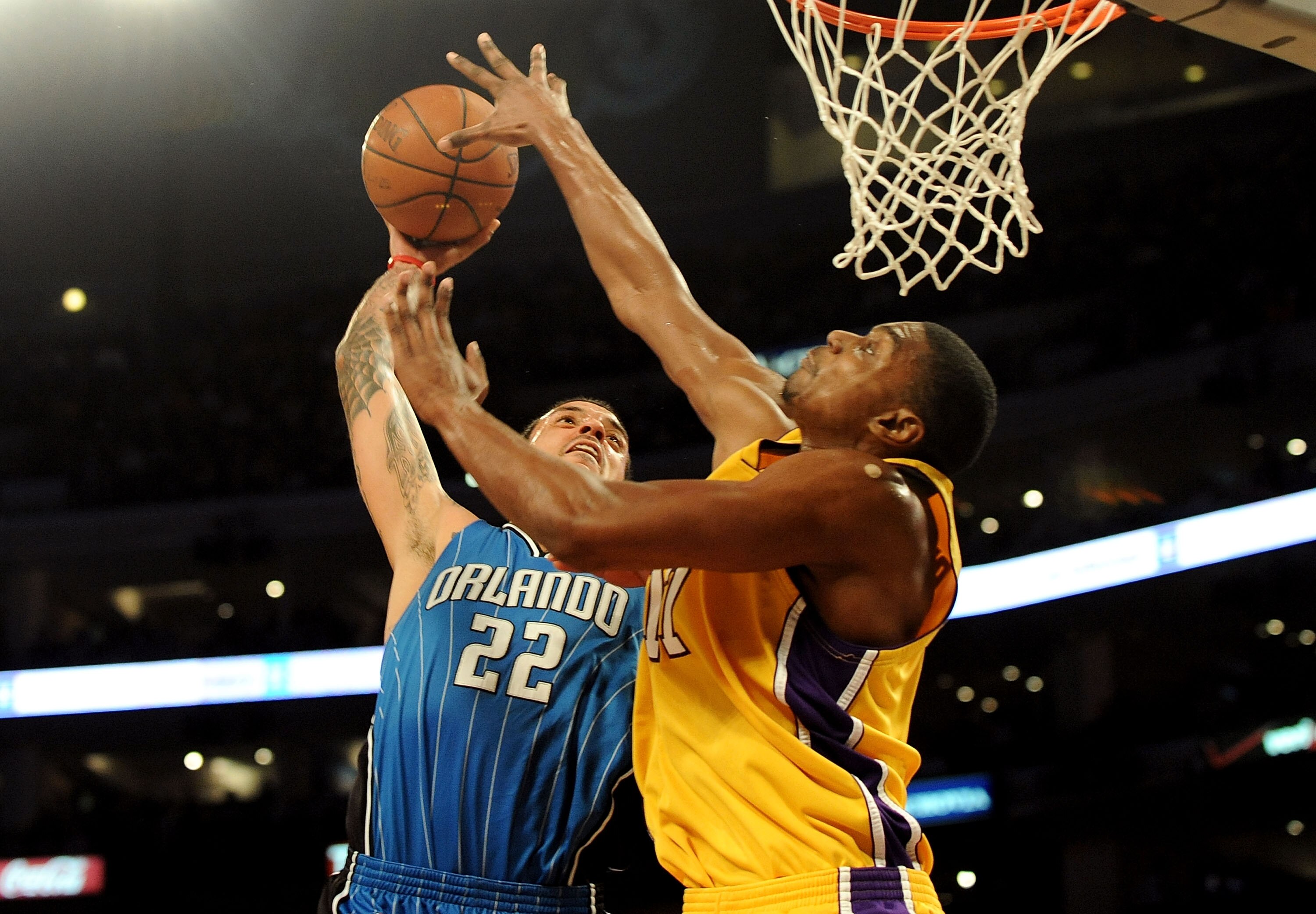 LOS ANGELES, CA - JANUARY 18: Andrew Bynum #17 of the Los Angeles Lakers blocks the shot by Matt Barnes #22 of the Orlando Magic in the third quarter during the game on January 18, 2010 at Staples Center in Los Angeles, California. NOTE TO USER: User expr LOS ANGELES, CA - JANUARY 18: Andrew Bynum #17 of the Los Angeles Lakers blocks the shot by Matt Barnes #22 of the Orlando Magic in the third quarter during the game on January 18, 2010 at Staples Center in Los Angeles, California. NOTE TO USER: User expr