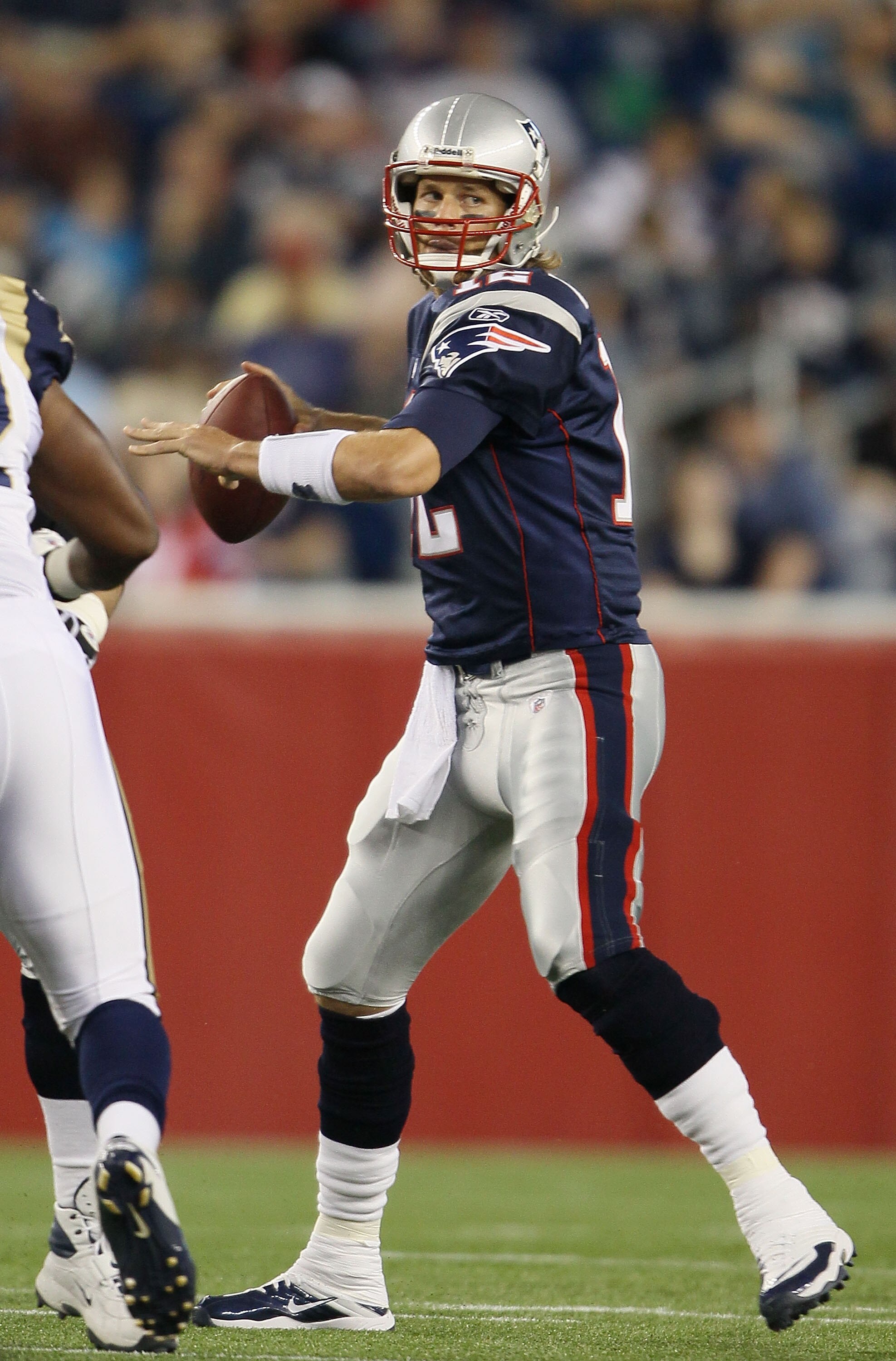 FOXBORO, MA - AUGUST 26:  Tom Brady #12 of the New England Patriots looks to pass in the first half against the St. Louis Rams on August 26, 2010 at Gillette Stadium in Foxboro, Massachusetts.  (Photo by Elsa/Getty Images)