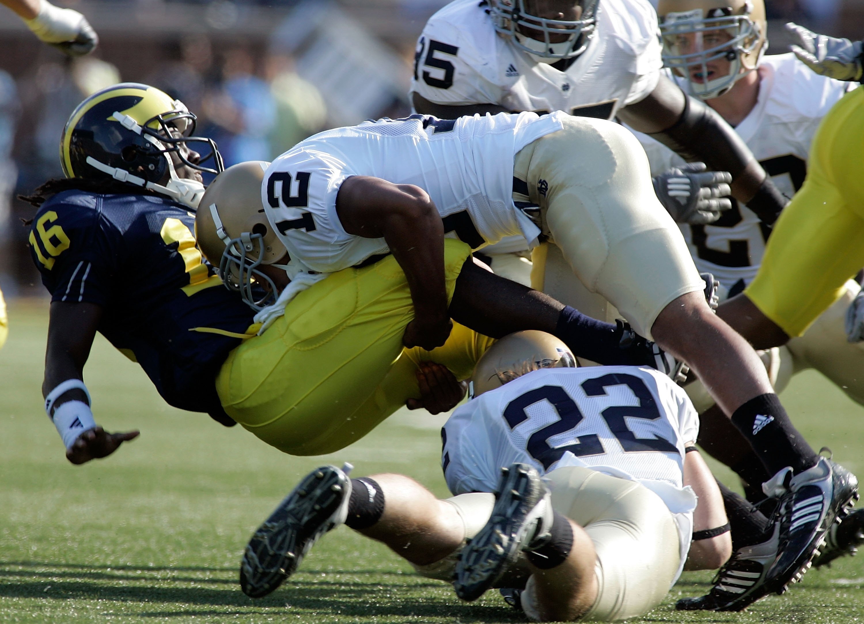 ANN ARBOR, MI - SEPTEMBER 12:  Denard Robinson #16 of Michigan gets tackled by Robert Blanton #12 of Notre Dame at Michigan Stadium on September 12, 2009 in Ann Arbor, Michigan.  (Photo by Domenic Centofanti/Getty Images)