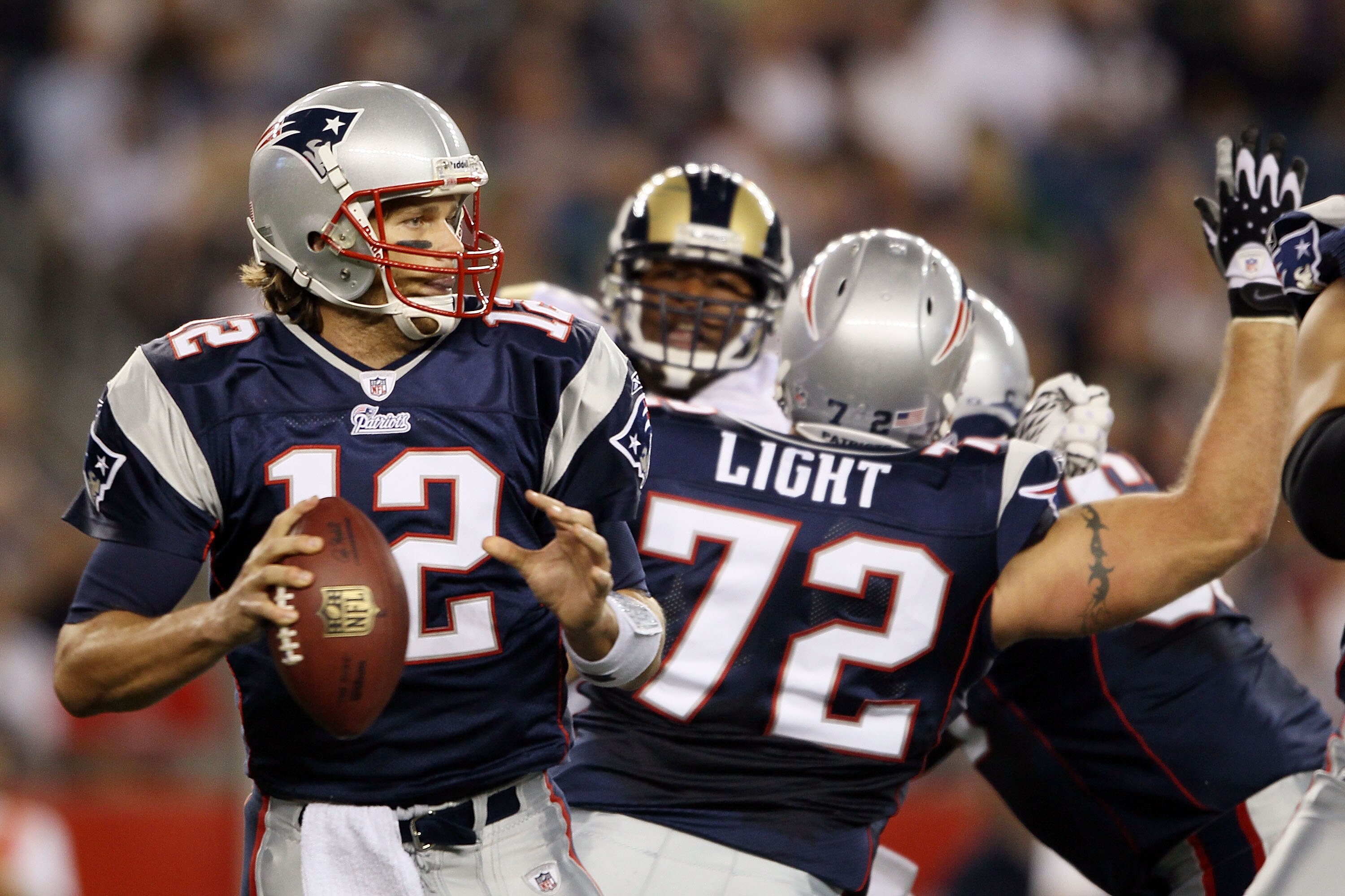 FOXBORO, MA - AUGUST 26:  Tom Brady #12 of the New England Patriots looks to pass in the first half against the St. Louis Rams on August 26, 2010 at Gillette Stadium in Foxboro, Massachusetts.  (Photo by Elsa/Getty Images)
