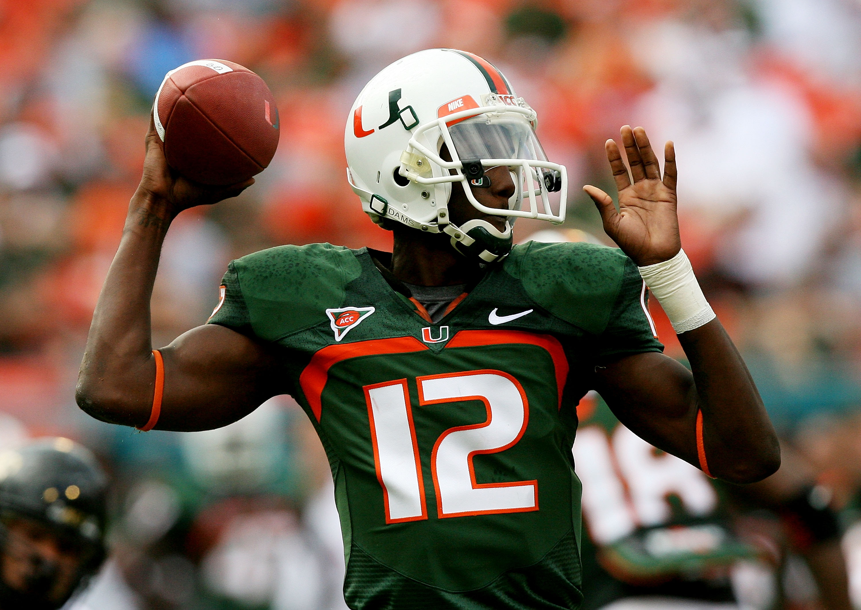 MIAMI - OCTOBER 25:  Quarterback Jacory Harris #12 of the Miami Hurricanes throws a pass against the Wake Forest Demon Decons at Dolphin Stadium on October 25, 2008 in Miami, Florida. Miami defeated Wake Forest 16-10.  (Photo by Doug Benc/Getty Images)