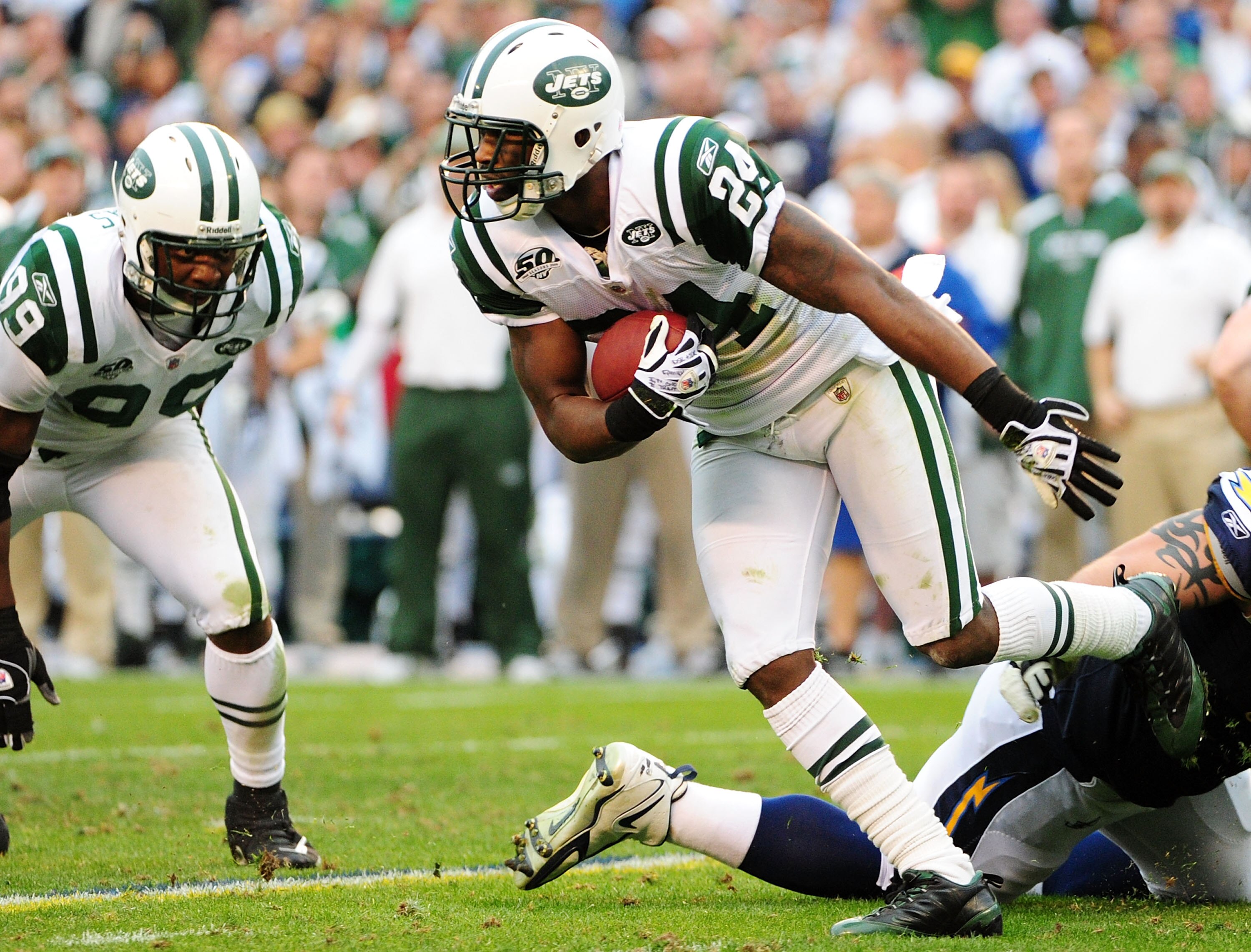 SAN DIEGO - JANUARY 17:  Cornerback Darrelle Revis #24 of the New York Jets runs after making an interception against the San Diego Chargers during  AFC Divisional Playoff Game at Qualcomm Stadium on January 17, 2010 in San Diego, California.  (Photo by R