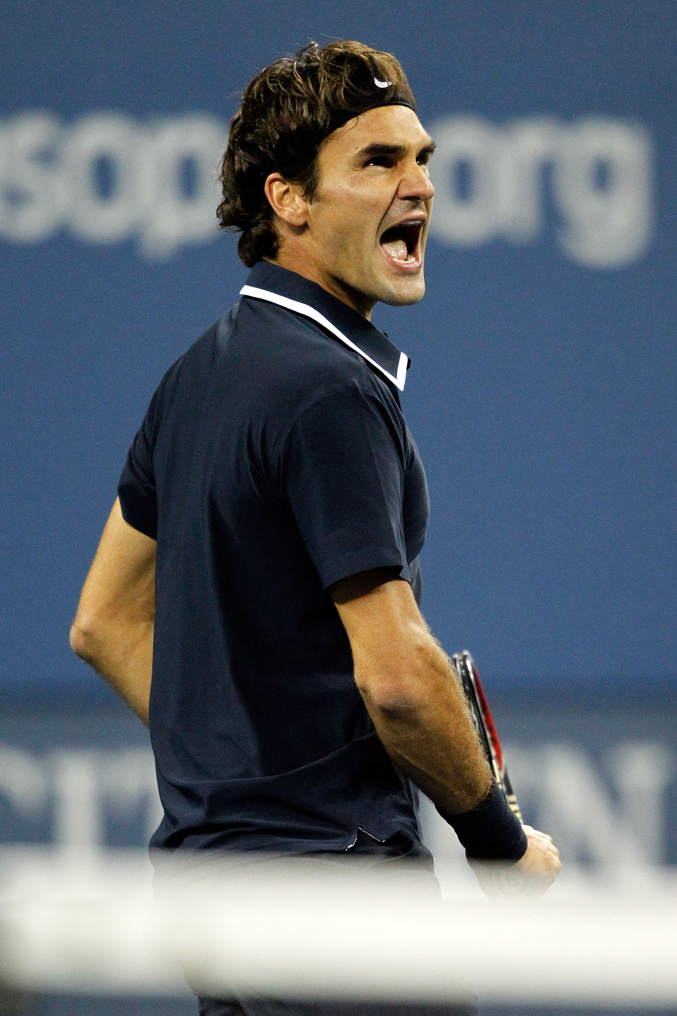NEW YORK - SEPTEMBER 08:  Roger Federer of Switzerland reacts after defeating against Robin Soderling of Sweden during his men's singles quarterfinal match on day ten of the 2010 U.S. Open at the USTA Billie Jean King National Tennis Center on September 8