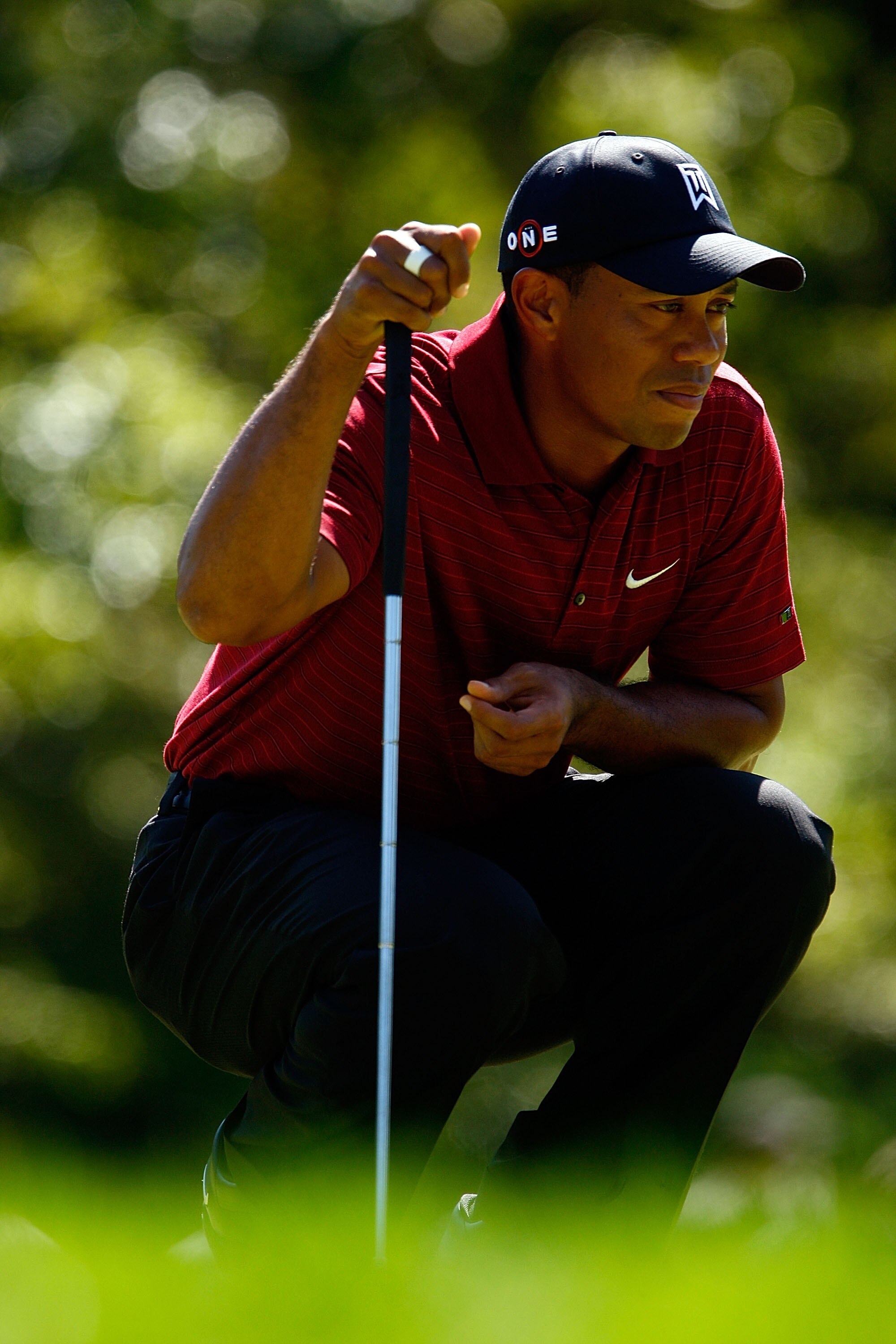 LEMONT, IL - SEPTEMBER 13:  Tiger Woods lines up a putt on the second green during the final round of the BMW Championship held at Cog Hill Golf & CC on September 13, 2009 in Lemont, Illinois.  (Photo by Scott Halleran/Getty Images)
