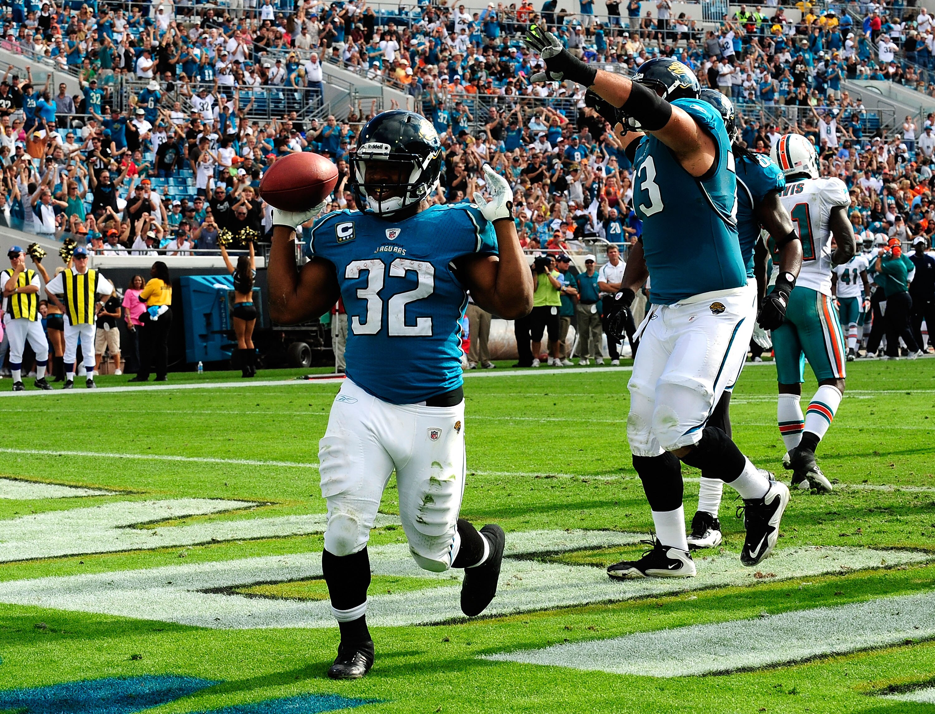 JACKSONVILLE, FL - DECEMBER 13:  Maurice Jones-Drew #32 of the Jacksonville Jaguars celebrates after scoring a touchdown during the game against the Miami Dolphins at Jacksonville Municipal Stadium on December 13, 2009 in Jacksonville, Florida.  (Photo by