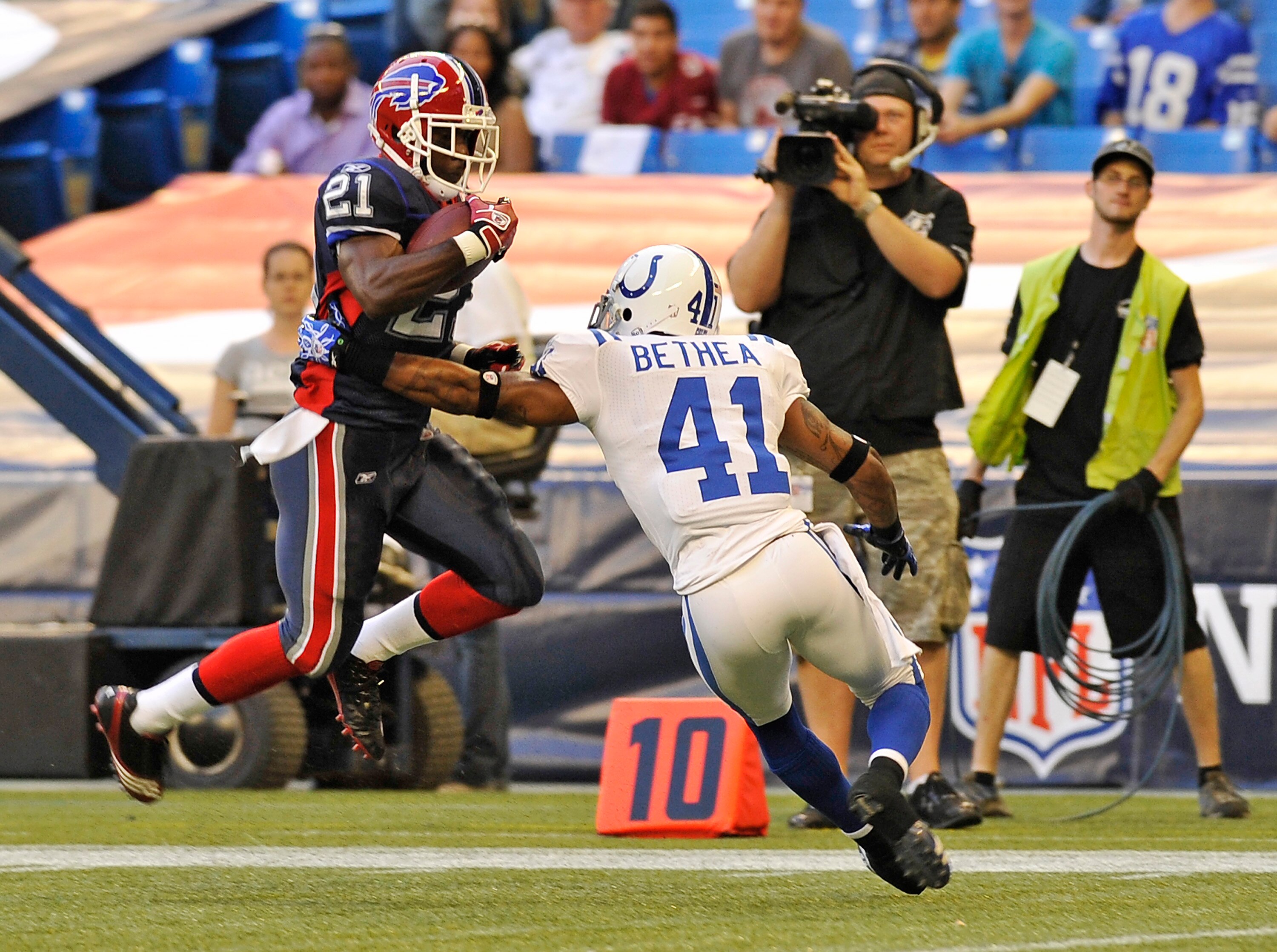 TORONTO, CANADA - AUGUST 19: C.J. Spiller #21 of the Buffalo Bills avoids the tackle of Antoine Bethea #41 of the Indianapolis Colts during game action August 19, 2010 at the Rogers Centre in Toronto, Ontario, Canada. (Photo by Brad White/Getty Images)