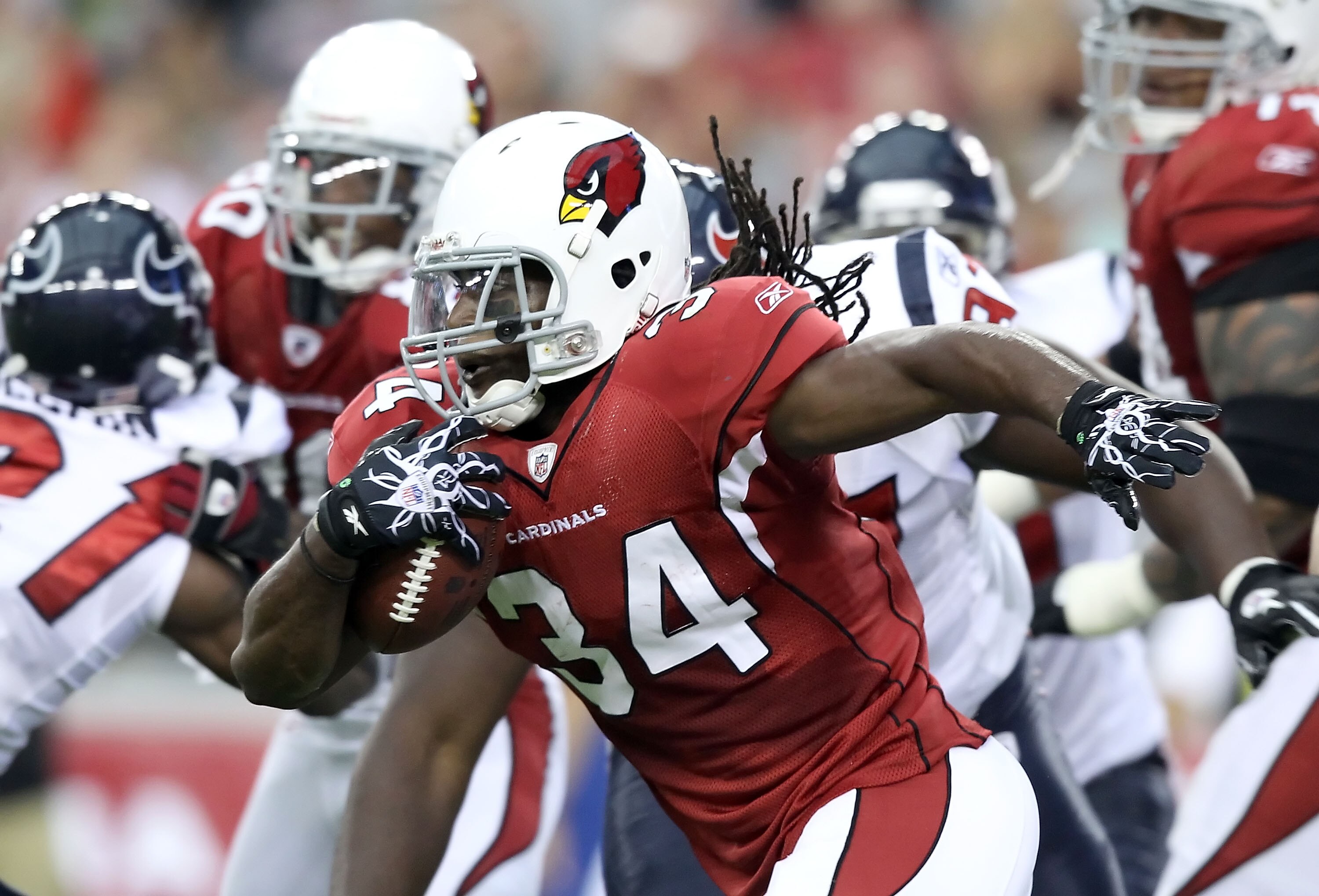 GLENDALE, AZ - AUGUST 14:  Runningback Tim Hightower #34 of the Arizona Cardinals rushes the football against the Houston Texans during preseason NFL game at the University of Phoenix Stadium on August 14, 2010 in Glendale, Arizona.  The Cardinals defeate