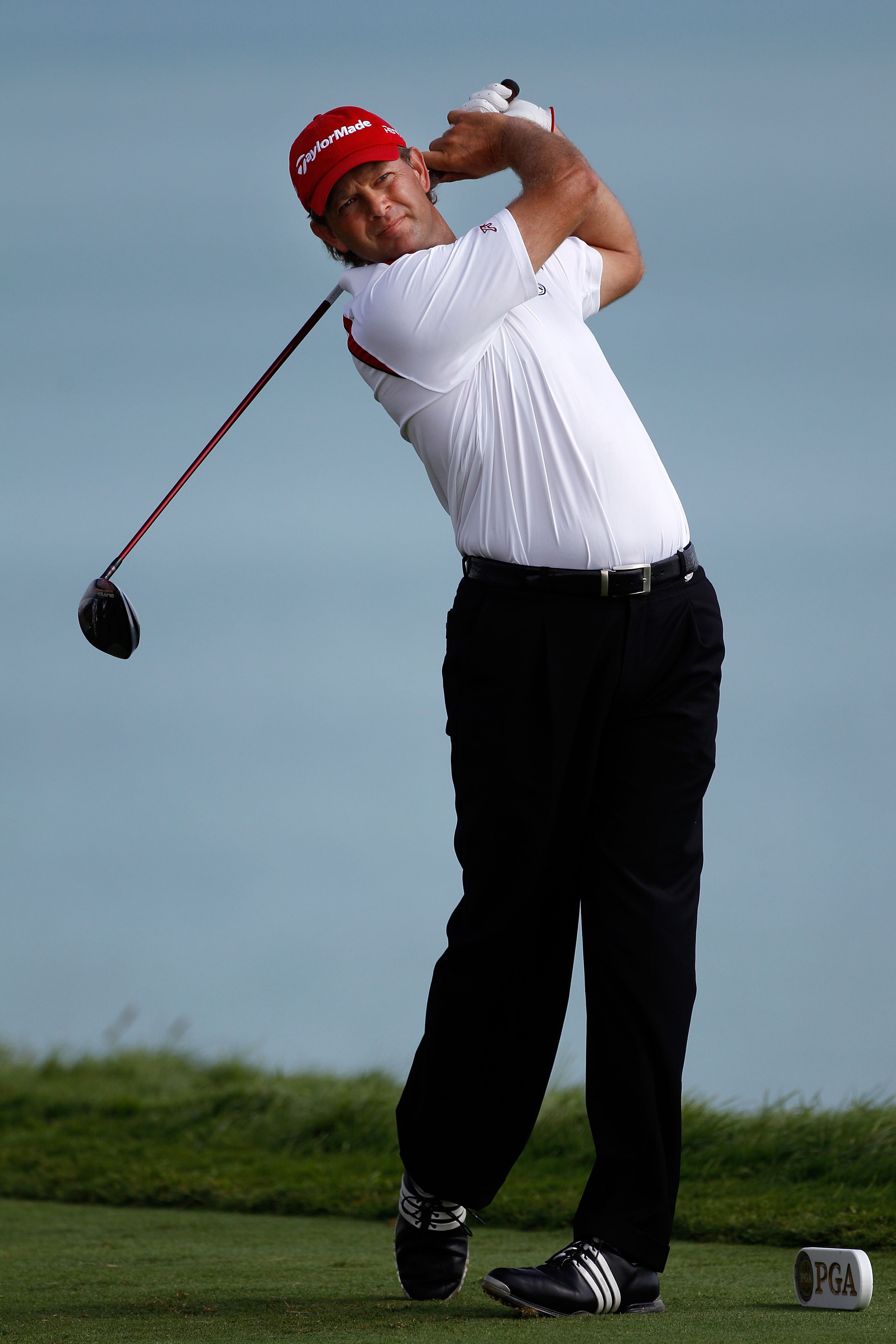 KOHLER, WI - AUGUST 14:  Retief Goosen of South Africa watches a shot on the 16th tee during the continuation of the second round of the 92nd PGA Championship on the Straits Course at Whistling Straits on August 14, 2010 in Kohler, Wisconsin.  (Photo by C