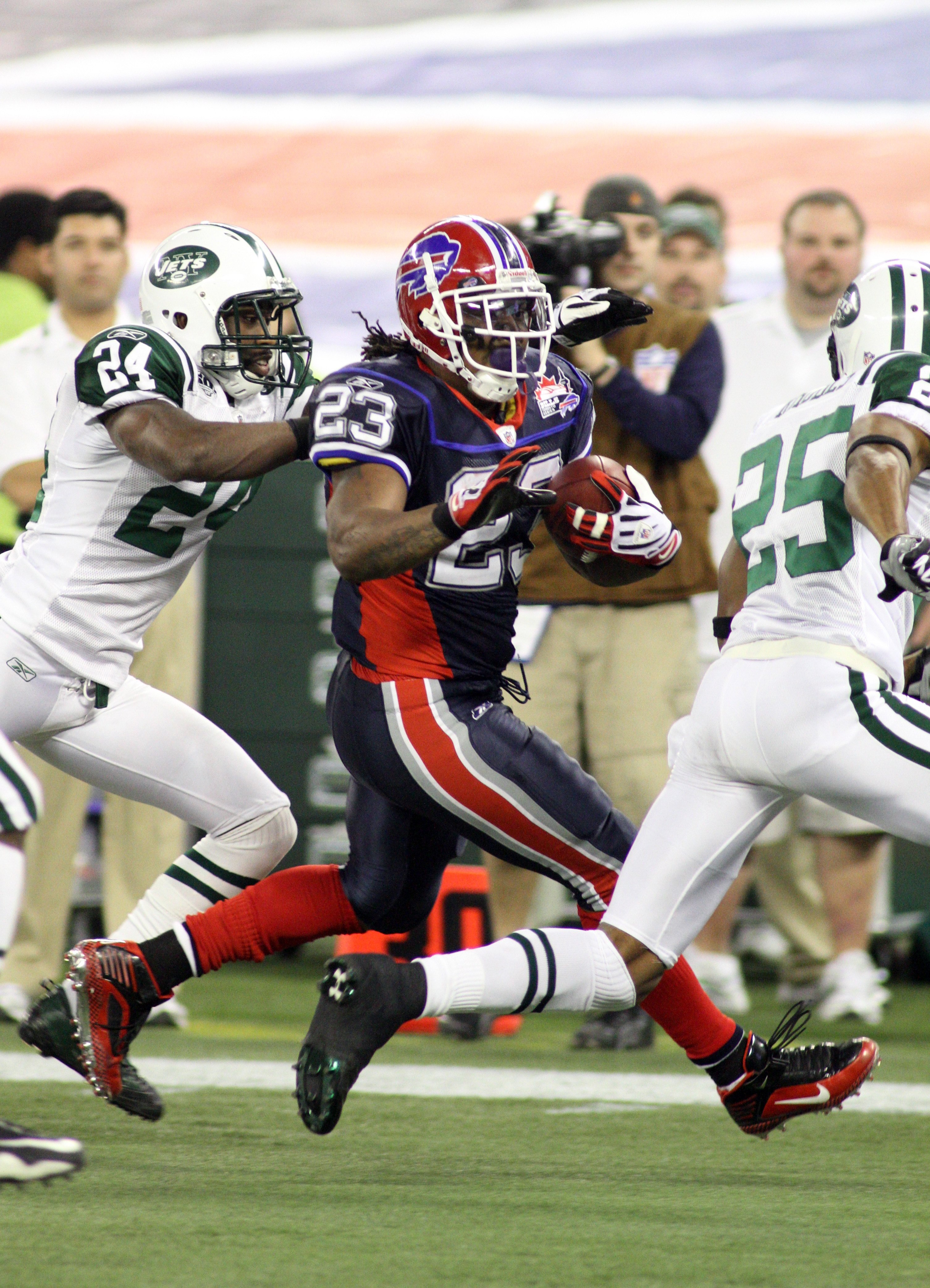 TORONTO - DECEMBER 3:  Running back Marshawn Lynch #23 of the Buffalo Bills runs with the ball for yardage during their NFL game against the New York Jets on December 3, 2009  at Rogers Centre in Toronto, Ontario, Canada. The Jets defeated the Bills 19-13
