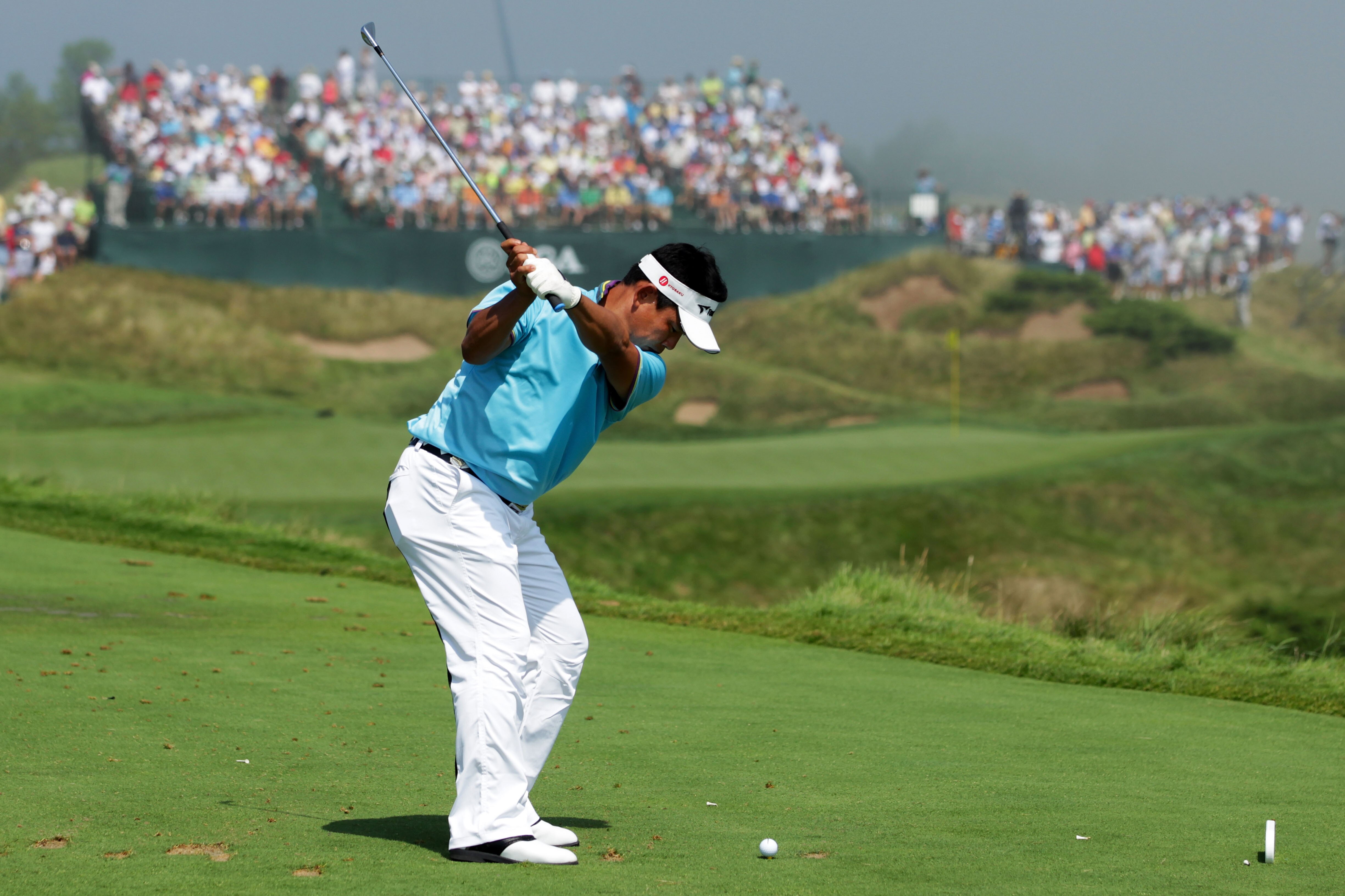KOHLER, WI - AUGUST 12:  K.J. Choi of South Korea hits his tee shot on the 12th hole during the first round of the 92nd PGA Championship on the Straits Course at Whistling Straits on August 12, 2010 in Kohler, Wisconsin.  (Photo by Andrew Redington/Getty