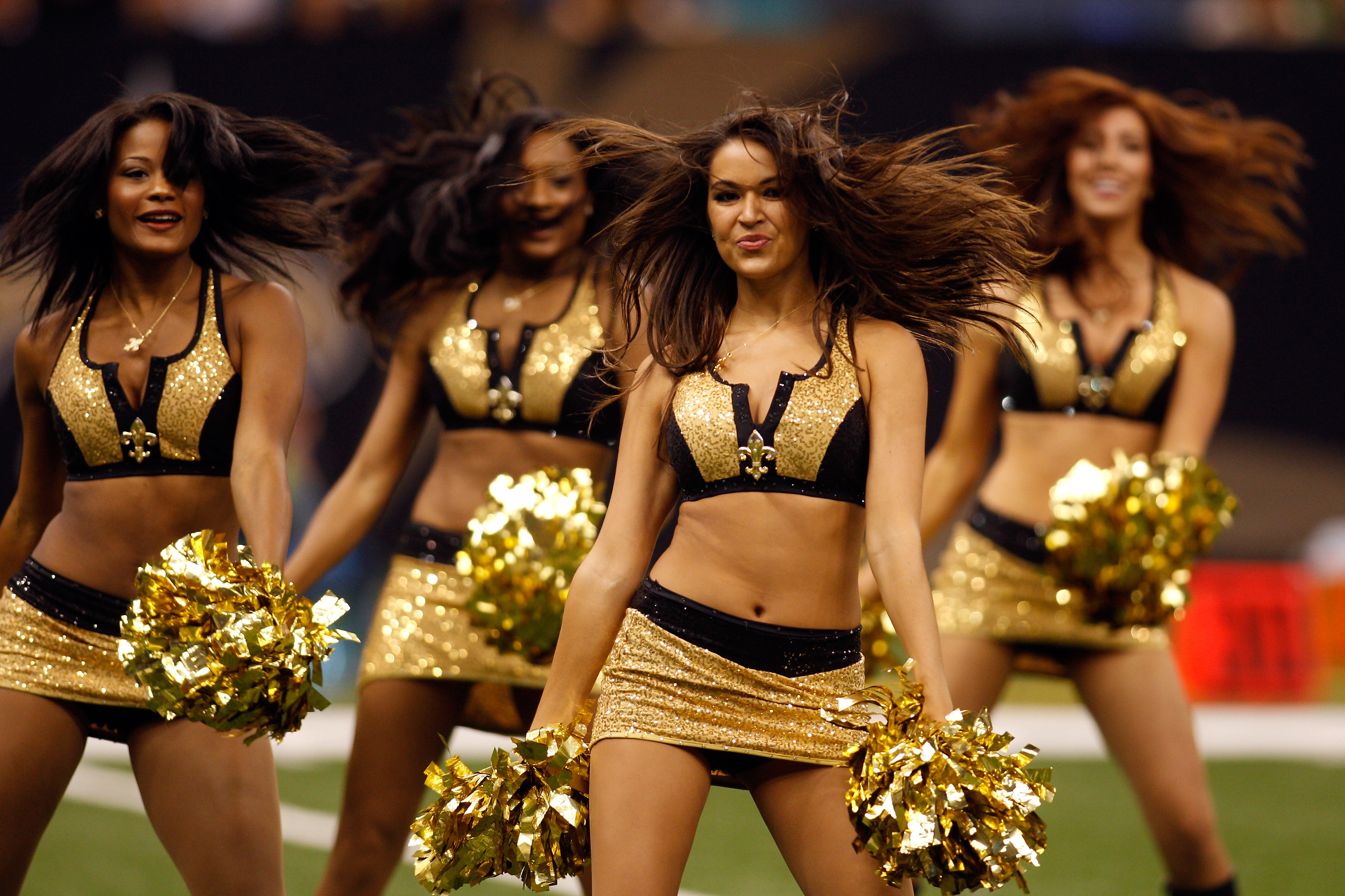 NEW ORLEANS - AUGUST 27:  Members of the Saintsations cheerleaders perform during the game between the New Orleans Saints and the San Diego Chargers at the Louisiana Superdome on August 27, 2010 in New Orleans, Louisiana.  (Photo by Chris Graythen/Getty I