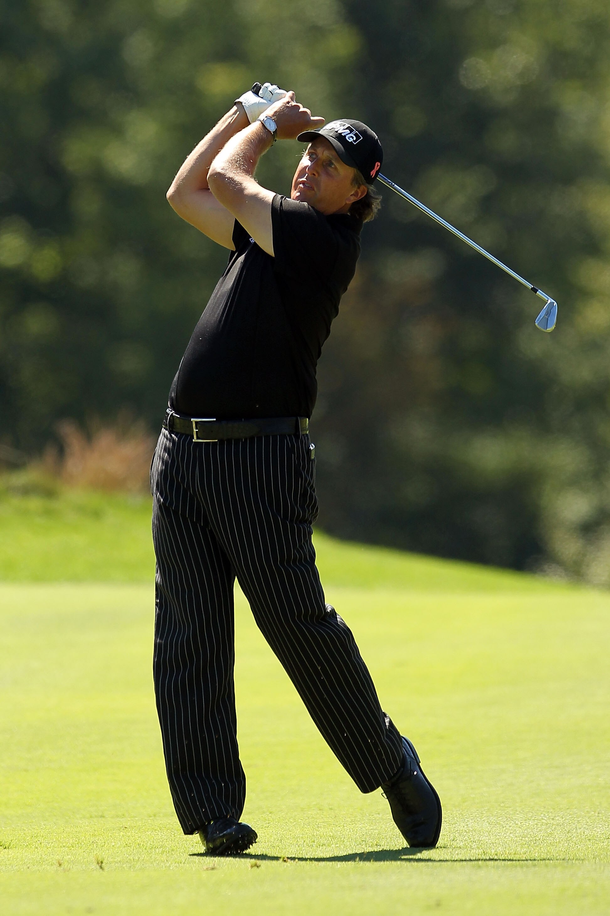 NORTON, MA - SEPTEMBER 06:  Phil Mickelson hits a shot on the second hole during the final round of the Deutsche Bank Championship at TPC Boston on September 6, 2010 in Norton, Massachusetts.  (Photo by Mike Ehrmann/Getty Images)
