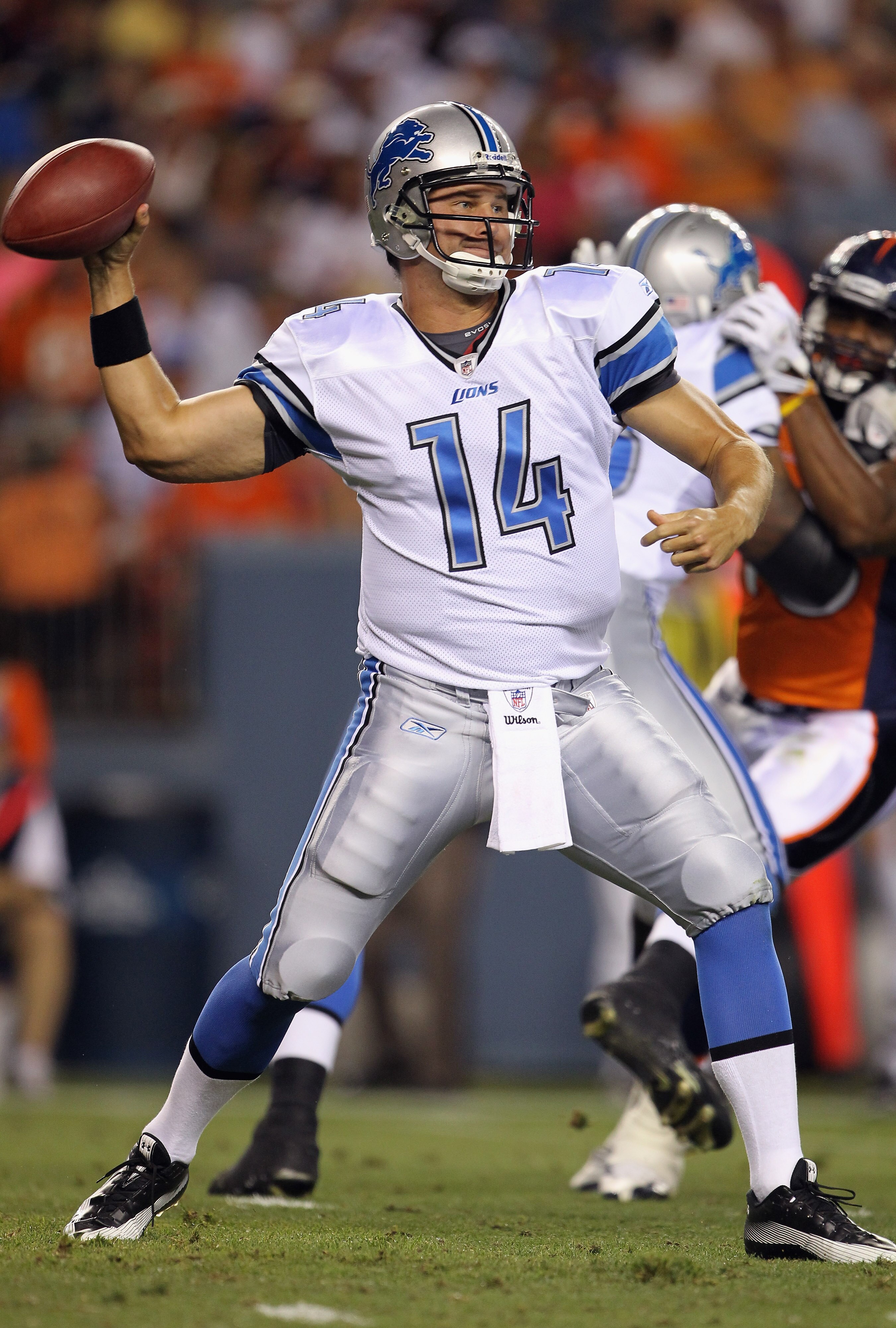 DENVER - AUGUST 21:  Quarterback Shaun Hill #14  of the Detroit Lions delivers a pass against the Denver Broncos during preseason NFL action at INVESCO Field at Mile High on August 21, 2010 in Denver, Colorado. The Lions defeated the Broncos 25-20.  (Phot