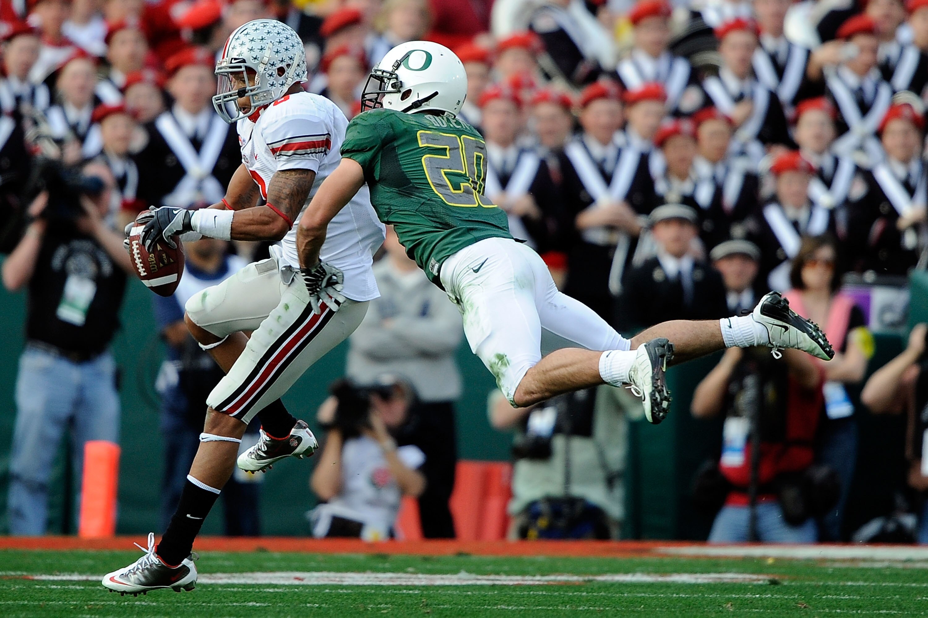 PASADENA, CA - JANUARY 01:  Wide receiver DeVier Posey #8 of the Ohio State Buckeyes makes a catch in front of safety John Boyett of the Ohio State Buckeyes during the 96th Rose Bowl game on January 1, 2010 in Pasadena, California.  (Photo by Kevork Djans