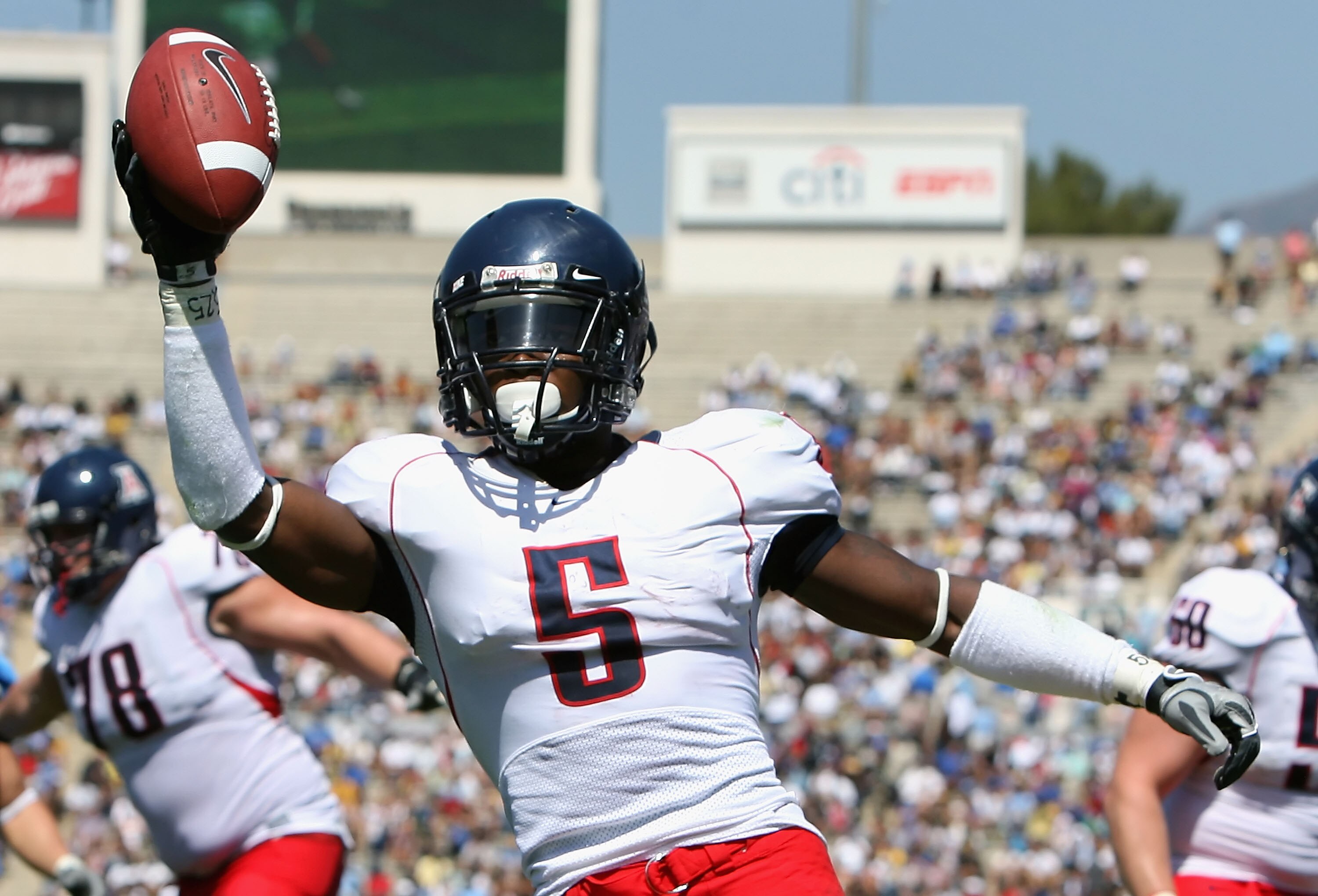 PASADENA, CA - SEPTEMBER 20:  Running back Nic Grigsby #5 of the Arizona Wildcats celebrates after scoring a 3 yard rushing touchdown against the UCLA Bruins during the second quarter of the college football game at the Rose Bowl on September 20, 2008 in