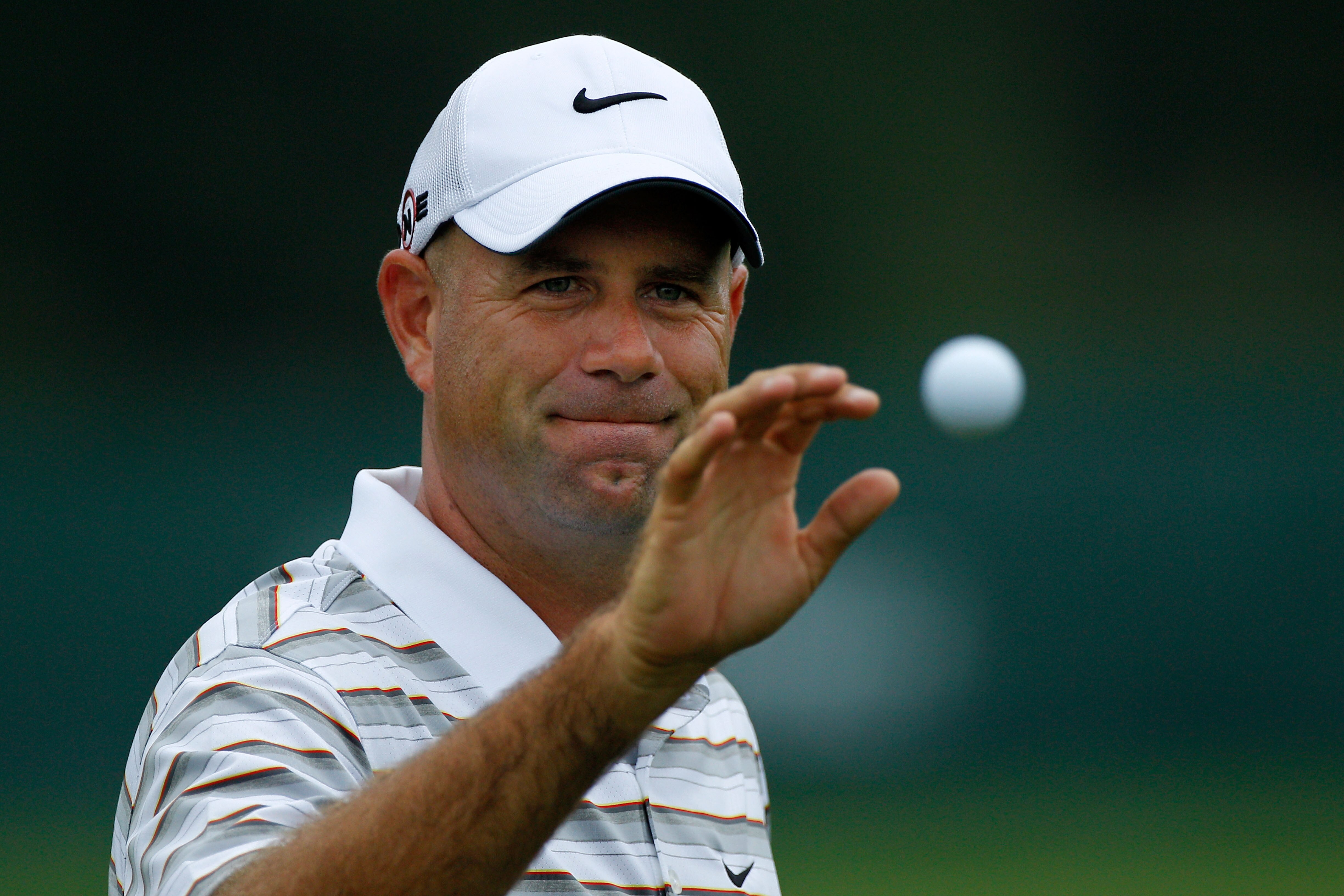 AKRON, OH - AUGUST 05:  Stewart Cink catches a ball during the first round of the World Golf Championships - Bridgestone Invitational on the South Course at Firestone Country Club on August 5, 2010 in Akron, Ohio.  (Photo by Sam Greenwood/Getty Images)