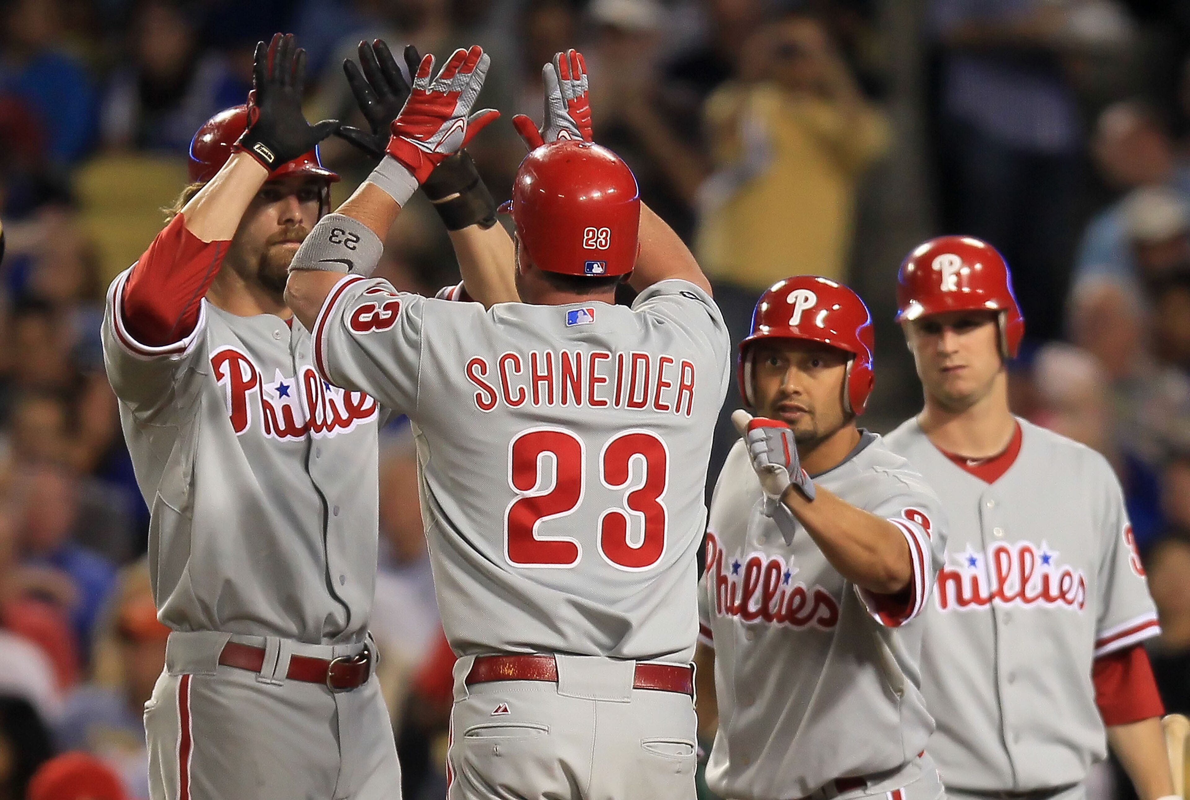LOS ANGELES, CA - AUGUST 31:  (L-R) Jayson Werth #28, Brian Schneider #23 and Shane Victorino #8 of the Philadelphia Phillies celebrate Schneider's three-run home run in the second inning against the Los Angeles Dodgers at Dodger Stadium on August 31, 201