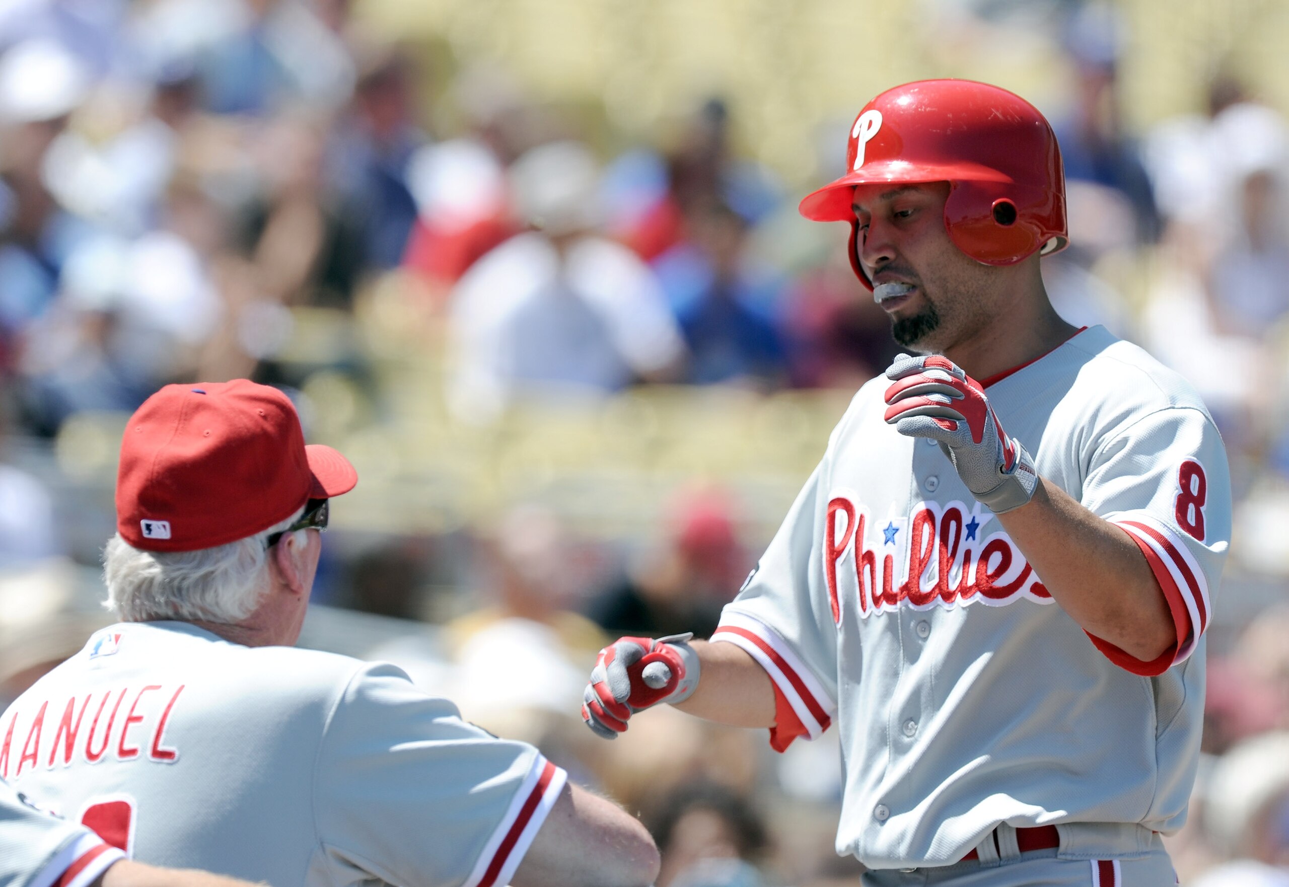 LOS ANGELES, CA - SEPTEMBER 01:  Shane Victorino #8 of the Philadelphia Phillies celebrates his solo homerun with Manager Charlie Manuel #41 off of Clayton Kershaw #22 of the Los Angeles Dodgers for a 2-0 lead during the second inning at Dodger Stadium on